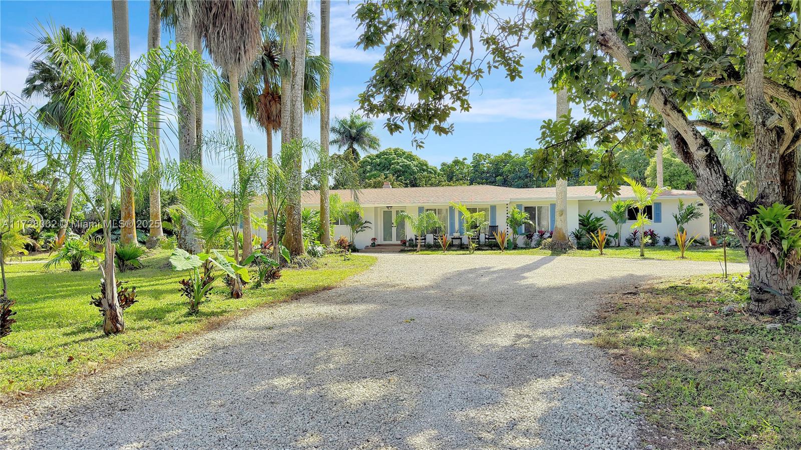 Welcome to your private retreat on a 1.5-acre agricultural-zoned lot in the Redlands where Rural meets Modern Living! Fully remodeled home offers new 2-yr-old roof, new AC, & impact windows & doors for peace of mind. The open layout features abundant natural light, fireplace, & a stunning sunroom w/ panoramic views. Brand new pool perfect for entertaining & yard is filled with mature fruit trees—avocado, mango, star fruit, loquat, guava, june plum, & soursop ideal for farm-to-table lifestyle right in your backyard. Paddock is ready for your animals, while the private off-road entry ensures tranquility & seclusion. Great schools district & in Unincorporated Dade for tax benefits. Walking distance to Knaus Berry Farm & within 10 mins of Publix, Florida Turnpike, & top Homestead attractions.