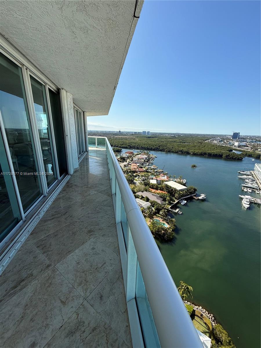 4 bedrooms / 4.5 bathrooms over almost 4000 sq ft. w/ wraparound balcony facing incredible west/sunset views from Downtown Miami to Oleta Park and the ocean. This apartment covers half the building - it's a Tower Suite, just below penthouse. Layout is really spacious with a primary "wing" with its own balcony. Interior is elegant and regal; custom moulding and marble flooring throughout (including balcony), closets and kitchen in custom wood, separate open bar room, (antique furniture/paintings negotiable, including a white baby grand piano!), hurricane shutters, AMAZING AMENITIES: separate beach club with restaurant, fitness, spa. 3 parking spaces, 1 storage unit, friendly staff and neighbors