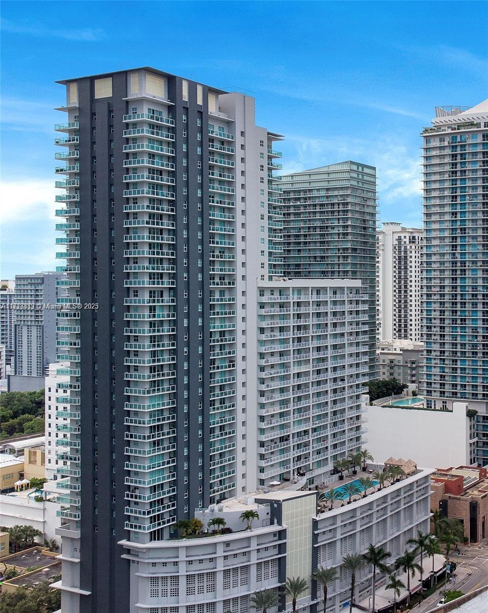 1 bed 1 1/2 bath. Located in the heart of the vibrant Brickell. Updates in process. This unit comes with polished concrete floors, spacious bedroom, large kitchen, and a wide balcony overlooking the city. With its prime location, you'll have easy access to Mary Brickell Village and Brickell City Center. Enjoy stunning views from the balcony and take advantage of the building's top-notch amenities, including a fitness center and swimming pool. Full size washer and dryer in unit, Basic cable is included. This unit comes with 1 assigned covered parking.