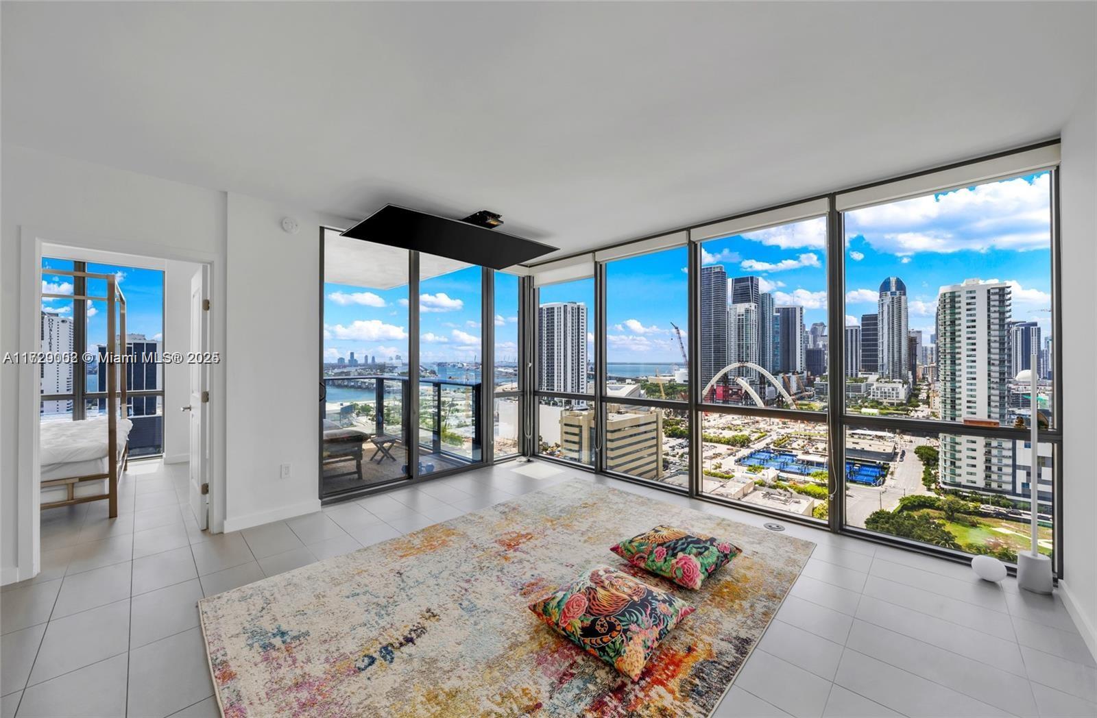 Hidden Gem! Stunning Skyline & Water Views! Must See. Available for 6 months or a 1-year lease! Beautifully 2-bed, 2-bath unit in the desirable 06 line—the best line in the building! Includes 1 Parking space and 1 Valet. With 1,040 sq. feet of living space, it features 9-foot high ceilings, walk-in closets, impact windows, and an expansive terrace with direct access from the primary bedroom with en-suite. Floor-to-ceiling windows provide breathtaking views of the water and downtown cityscape. Amazing sunrise and sunset views from every room. Rent includes everything except electricity. The building boasts 30,000 sqft of amenities, inc. 3 pools, jacuzzi & sauna. Minutes away from the Airport, Wynwood, South Beach, Brickell, Shops, and Museums