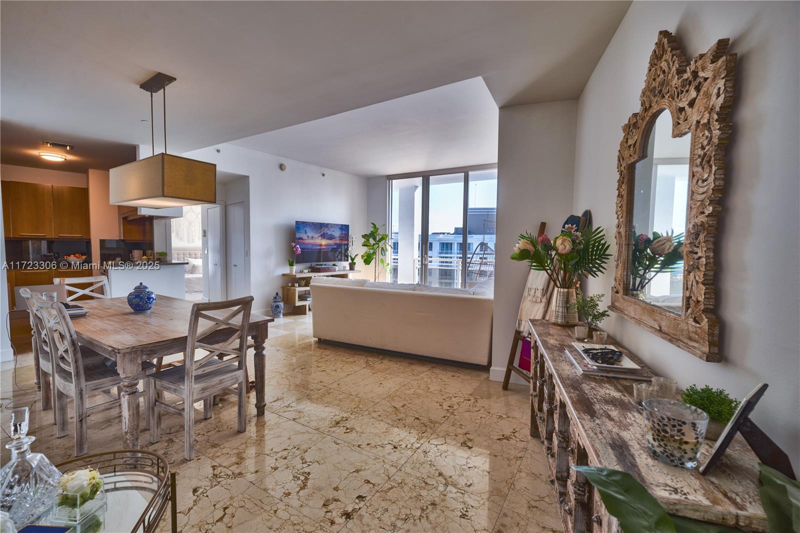 Experience this oversized 1BD 1.5BA unit in the exclusive Carbonell located on the peaceful semi-private island of Brickell Key. Enjoy the ocean breeze from the oversized wrap-around balcony with views of Key Biscayne, Brickell Bay and the Brickell Key Park. The apartment is rented fully furnished with tasteful decor, marble floors throughout the living room, and recently installed tile wood in the bedroom. Samsung washer/dryer, plentiful storage space, walk in master closet and modern appliances allow for easy living in a luxury building with incredible amenities: world class gym, basketball+racquetball courts, large pool deck, and more. Embrace the tranquil Brickell Key lifestyle, a perfect choice for a Brickell professional or someone who can enjoy the views while work from home.