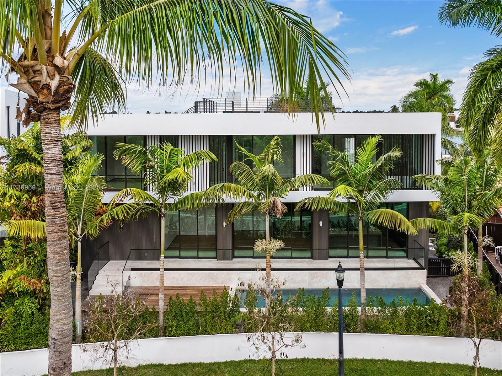 Just Completed! A rare opportunity to own a brand-new architectural gem on one of Miami’s most coveted islands. This residence offers 4 en-suite bedrooms and 3,077 sq. ft. of modern luxury. Featuring an open layout with sleek interior finishes, custom Italian kitchen + closets, seamless indoor-outdoor living, garage/parking court, private pool surrounded by lush landscaping, and a 370 sqft rooftop deck offering breathtaking water and skyline views. Island amenities include 24/7 police security, lighted basketball/tennis courts, and a children’s playground. Centrally located just minutes from the best of South Beach, Downtown, and MIA Airport. The only new modern non-waterfront home available on the island!