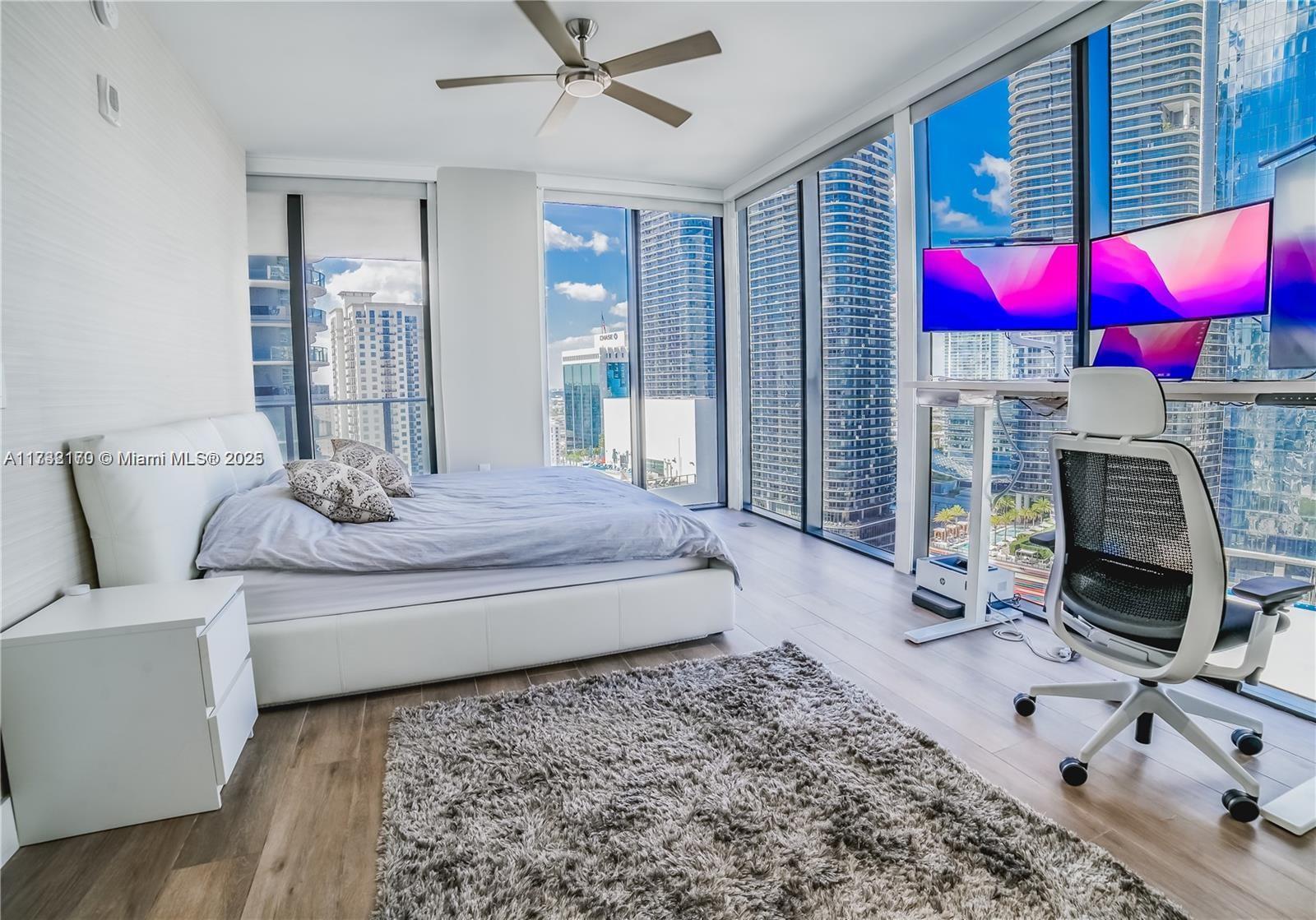 Fully furnished 1 Bedroom plus den (converted into bedroom with Queen bed). Includes stand up/sit down desk with multiple monitors. Perfect for working at home! This corner unit with great view makes this one of the best lines in the building! Your new home will have floor to ceiling  glass windows and a private balcony with glass railings! 1010 Brickell is a luxury building with top of the line amenities. This includes rooftop lounge, sunrise and sunset pool, outdoor theater, and fire pit. They also offers bocce ball court, squash, basketball, and a full service spa with a co-ed hammer, golf simulator and more.