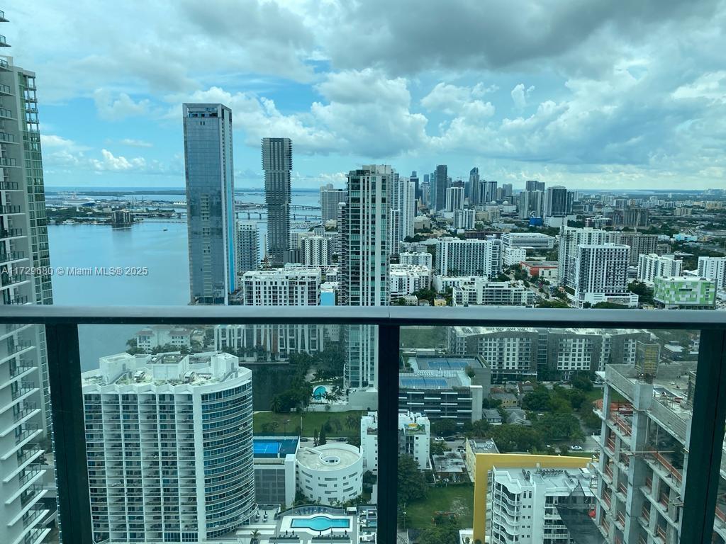 Stunning penthouse with 2 bedrooms and 2 bathrooms located in the vibrant Edgewater neighborhood. Massive wrap around balcony with access from the master bedroom and living room. Breathtaking views of the Miami skyline and Biscayne Bay. Amenities include a rooftop pool, tennis court, paddle court, BBQ areas, club room, kids room, billiard's room, theater, fitness center, spa, 24 hour valet parking and 24 hour concierge. Within walking distance from the Design District, Midtown and Wynwood. Only 15 min to Miami International Airport, and 10 minutes to Miami Beach.