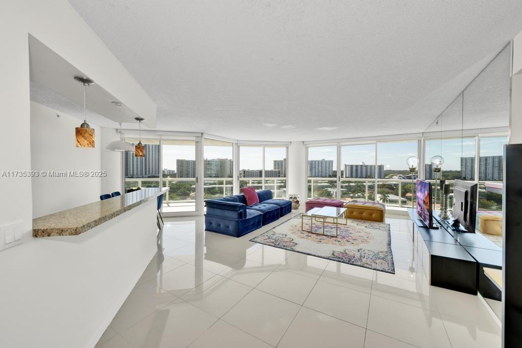 Experience breathtaking southeast views from this 2-bedroom, 2-bathroom residence on a private island in the heart of Sunny Isles. This stunning unit boasts an open kitchen and a spacious balcony, offering panoramic ocean and Intracoastal views from every room. Enjoy world-class amenities, including an oversized pool, tennis courts, and an exclusive private beach club. Ideally situated close to top-rated schools, premier shopping, fine dining, and vibrant entertainment. Nestled within a prestigious gated community with 24/7 security.