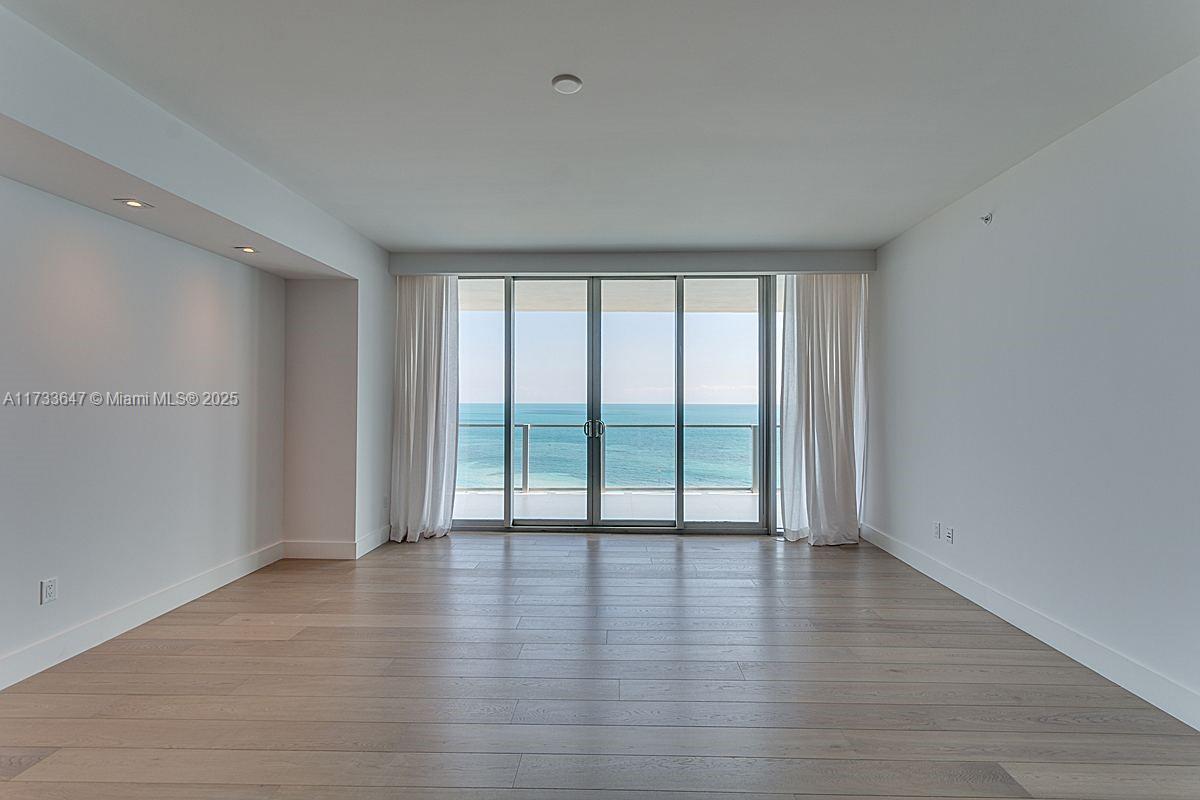 Step into luxury with this stunning residence at Oceana Key Biscayne, where direct ocean views greet you from every room. This spacious 2-bedroom + den, 3.5-bathroom unit boasts an expansive balcony, seamlessly blending indoor and outdoor living. The elegant hardwood floors add warmth and sophistication, while built-in closets, upgraded lighting fixtures, and electric shades provide both style and convenience. A private foyer and elevator enhance the exclusivity of this remarkable home. Beyond the residence, enjoy world-class amenities, including a state-of-the-art fitness center, luxurious spa, a stunning 100x100 pool, media room, private beach access, and on-site dining. Oceana Key Biscayne offers the perfect blend of privacy, elegance, and resort-style living.