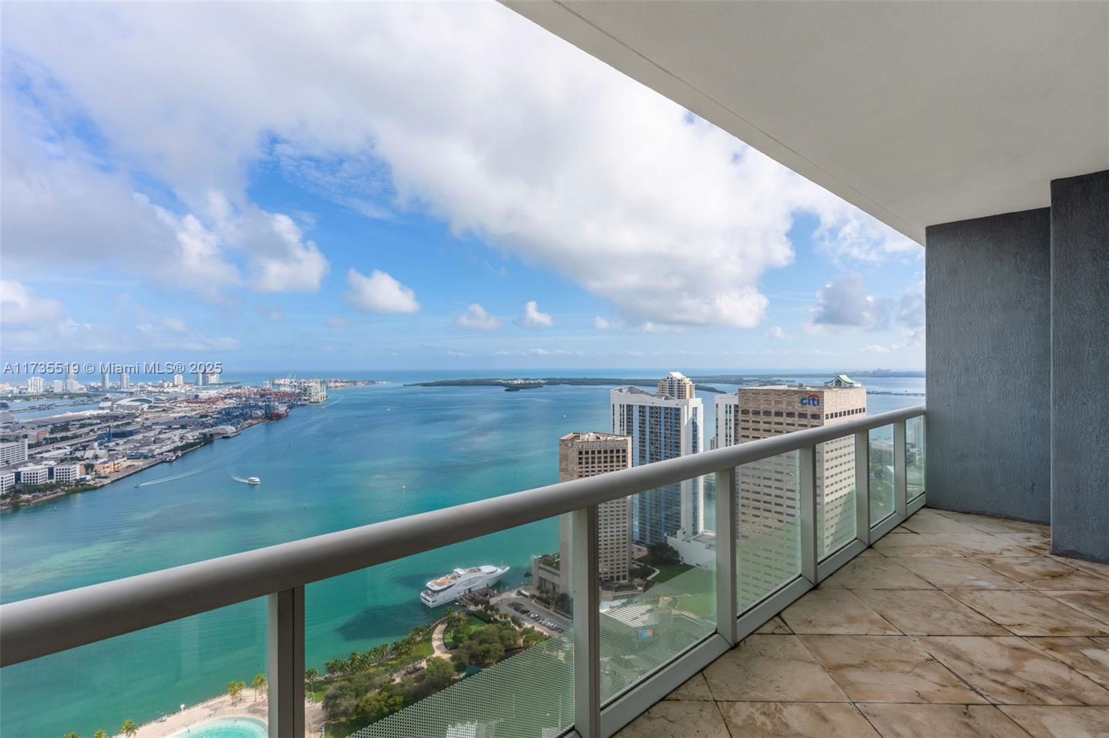 Discover unparalleled luxury and breathtaking views from the 54th floor at 50 Biscayne. This penthouse unit 
features 2 bedrooms + den, and floor-to-ceiling windows, offering sweeping vistas of the beautiful blue waters of Biscayne Bay. Designed with elegance, it boasts marble flooring throughout, elegant crown molding, recessed lighting, and volume ceilings, creating a sophisticated yet inviting ambiance. Residents enjoy world-class amenities, including 24-hour concierge and security, a state-of-the-art fitness center, an infinity-edge pool, jacuzzi, cabanas, sauna and spa. Ideally located just minutes from Brickell and a quick trip over the bridge to Miami Beach, with shops, dining and entertainment nearby. Ready for immediate occupancy!