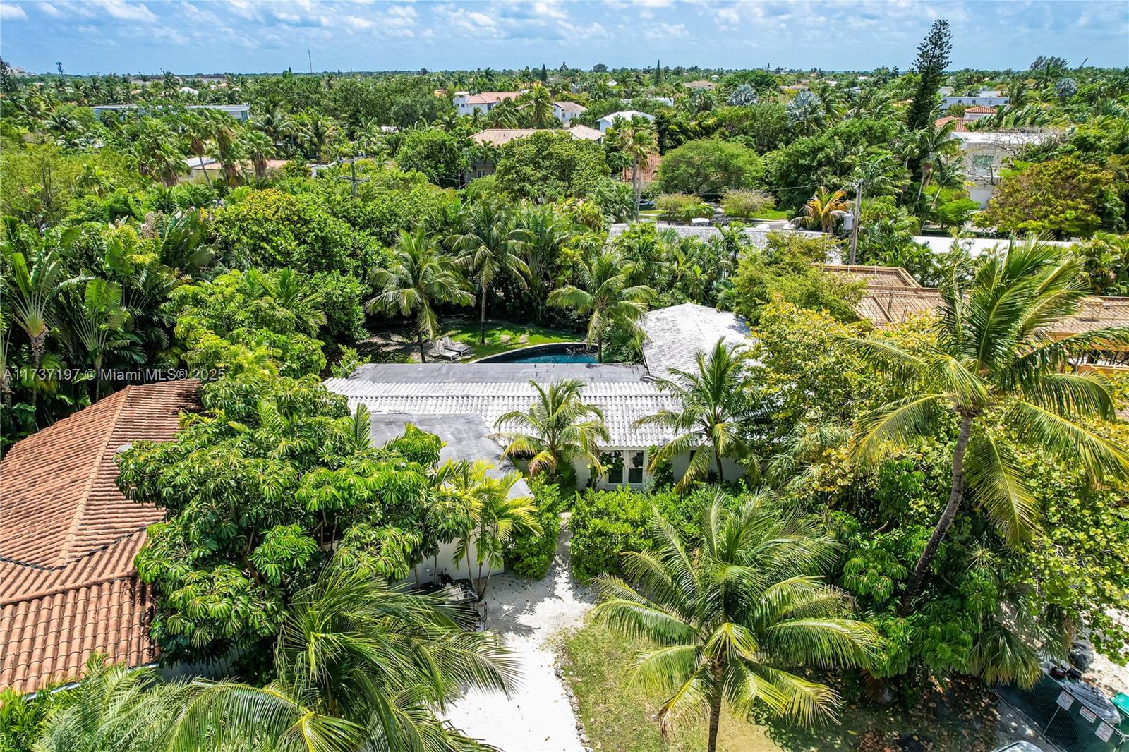 Very Charming Corner House located in a quiet street. The entrance door opens up to the Living/Patio areas and a gorgeous pool surrounded by a huge pie shaped yard (over 11,000 sq.ft. as per licensed surveyor). House features 4 Bedrooms (one is the maid's room), 3 Full Baths and an Office Room, High Impact windows, cement floors throughout.