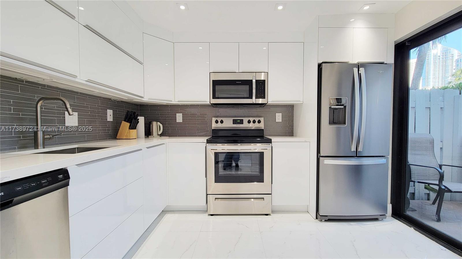 UNIQUE TOWNHOUSE ON PRIVATE ISLAND!!! 3B/3B Townhome for sale on the desirable Poinciana Island Sunny Isles. Downstairs the home features ceramic throughout, a new kitchen with stainless steel appliances, granite countertops, and white high gloss cabinetry. A massive living room with dining, and a half bath perfect for entertaining. The high ceiling with various lights set up makes the environment perfect for gatherings with family and friends. The patio has breathtaking intercostal views, an eating area and BBQ. Upstairs there is a full bedroom suite with a double sink in the bathroom, and two spacious guestrooms with one full bath, and laundry. The community features a resort lifestyle with a pool, tennis courts, and relaxing walkways by the water. Enjoy your life in the paradise!