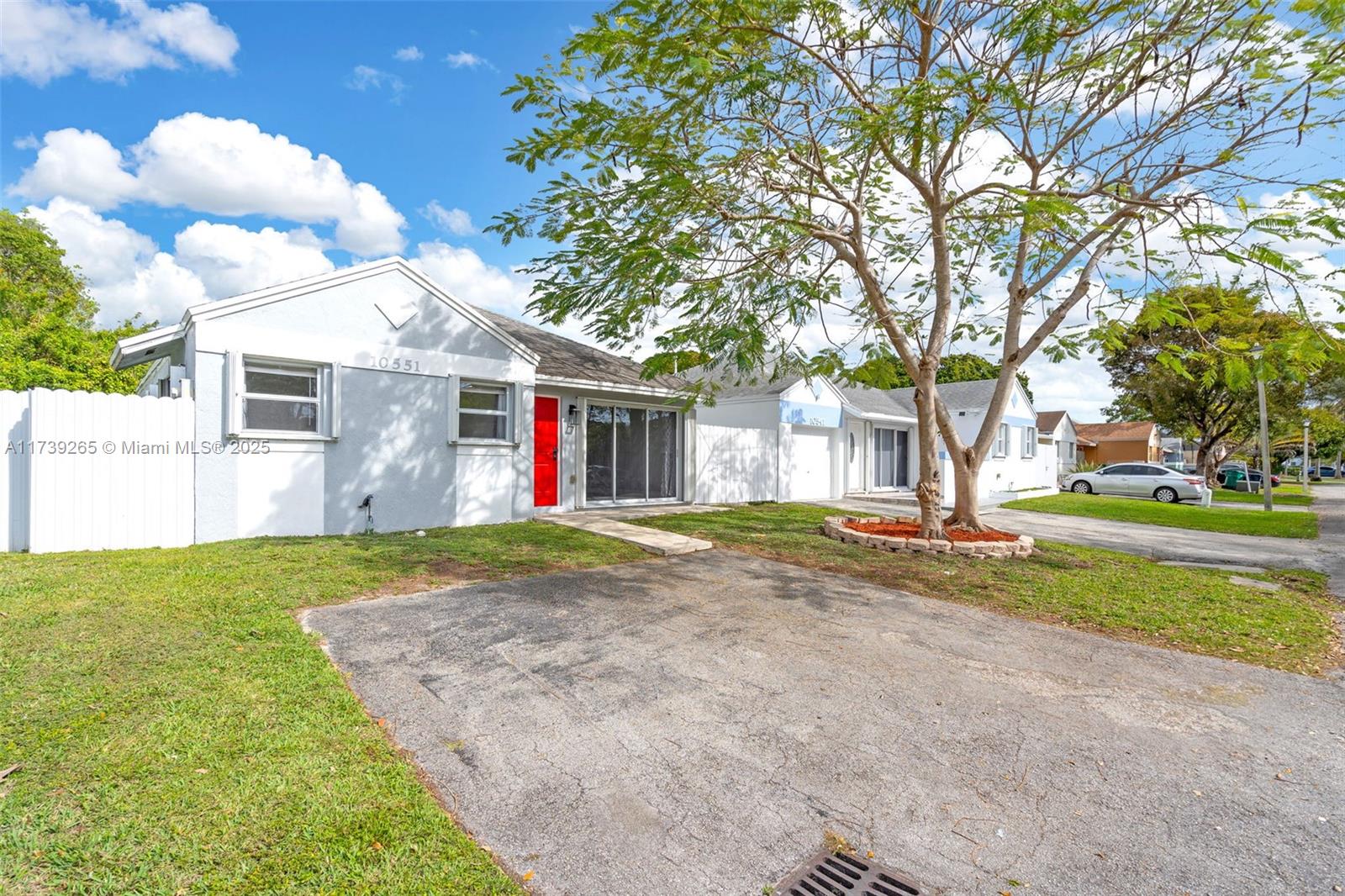 This charming 2-bedroom, 2-bathroom home is located in a peaceful cul-de-sac with minimal traffic, offering a serene and private living experience. The property boasts a spacious yard and side yard for additional parking. It features a recently renovated kitchen and bathrooms, with an AC unit and fence both about 2 years old, and hurricane shutters for added comfort and protection. The home is situated in a well-maintained community with a low monthly association fee of only $74. Thoughtfully cared for, this home is perfect for anyone looking for a comfortable and secure place to live. Conveniently located next to the Turnpike, Old Cutler, and US1, it offers easy access to major roads while maintaining a peaceful, quiet atmosphere.