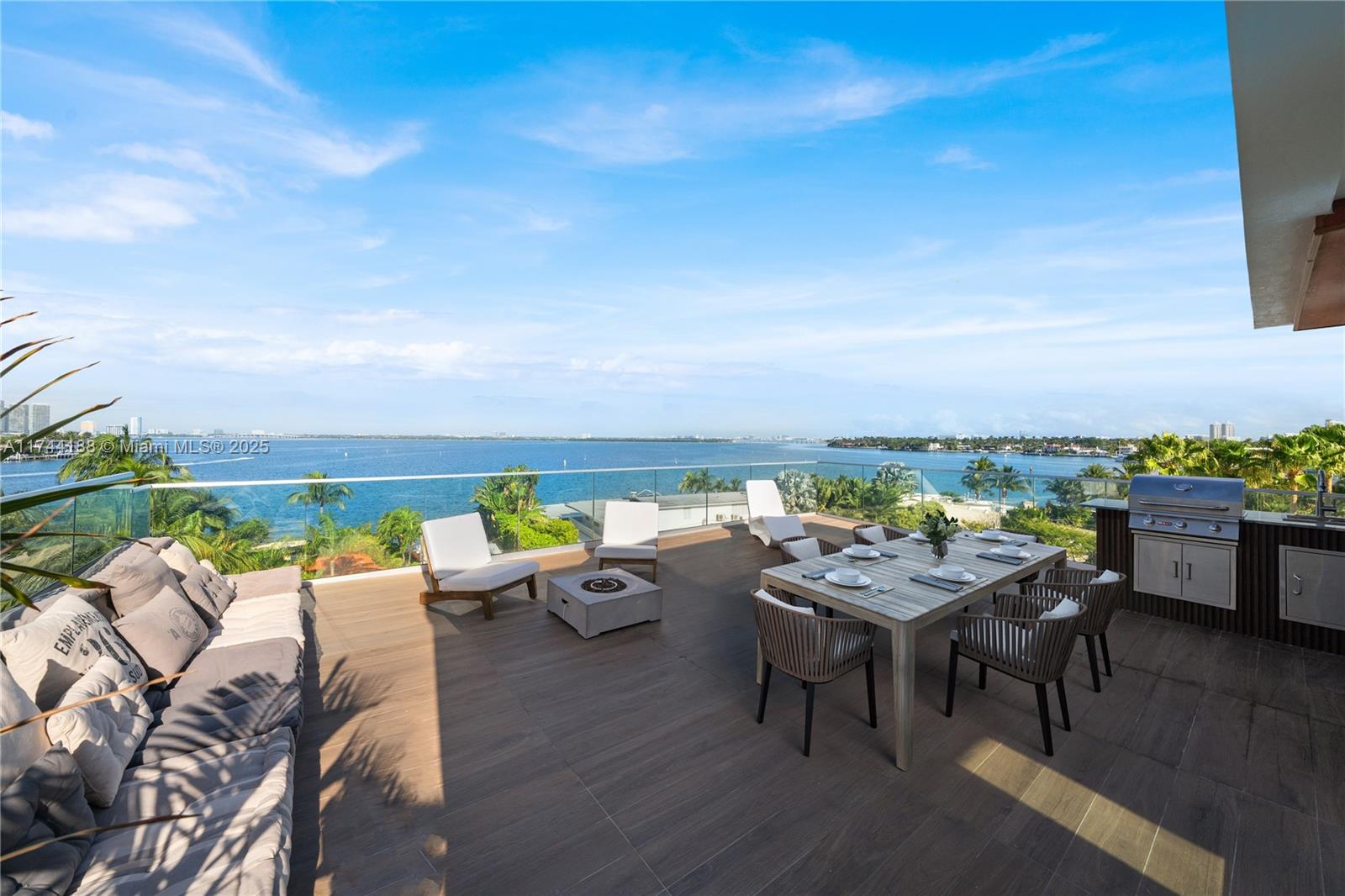LIVE THE VENETIAN ISLANDS LIFESTYLE AT VILLA EVA ~ A UNIQUE 5-STORY NEW MODERN LOFT-STYLE RESIDENCE W/POOL & ROOFTOP DECK W/DIRECT BISCAYNE BAY VIEWS! Villa Eva encompasses 3,358 SF of Interior w/3 Bedrooms + 3 Bath + 2 Powder Rooms. Elevator takes you Straight to Your Pool Deck & Rooftop Lounge w/Fully Equipped Summer Kitchen, Fire Pit & Bay Views. Second Floor with 11-FT Ceilings encompasses 2 Bedrooms w/Ensuite Baths + Walk-in Closets & Office Nook + Separate Laundry Room. Living Area w/Pool Deck & Water Views. Open Concept Kitchen/Dining Area in a Modern Eclectic Design. Primary Suite w/Spa-Like Bath & Separate Lounge Area w/Wet Bar + Terrace. Floor-to-Ceiling Windows, Custom Cabinetry. Laundry Chute on every floor for Convenience. Walled & Gated Covered Parking for 4 Cars.