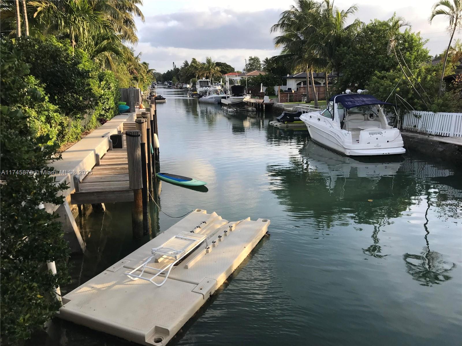 Motivated seller on Biscayne Point Island waterfront, NO FIXED BRIDGES, 2 docks, GUARD gated, garage. Actual area 3714 sq ft featuring 3 bed/ 3 bath in main house and a 1/1 guest house w/kitchen, balcony and private entrance. Galaxy Granite floors for entertaining, GAS cooking, Roof was 2010 A/C 2021, home was reconstructed in 2011 with Hurricane impact windows/doors, new seawall and dock, upgraded plumbing, 4 phase electrical panels and ready for an addition. Enjoy lots of parking, outdoor entertaining with a private pool, expansive patio, and direct ocean access.  Walk to the beach or boat ride to Haulover inlet. Lush landscaping with flowers. A dream location in the middle of NOBE and Bandshell. Add your personal touches.