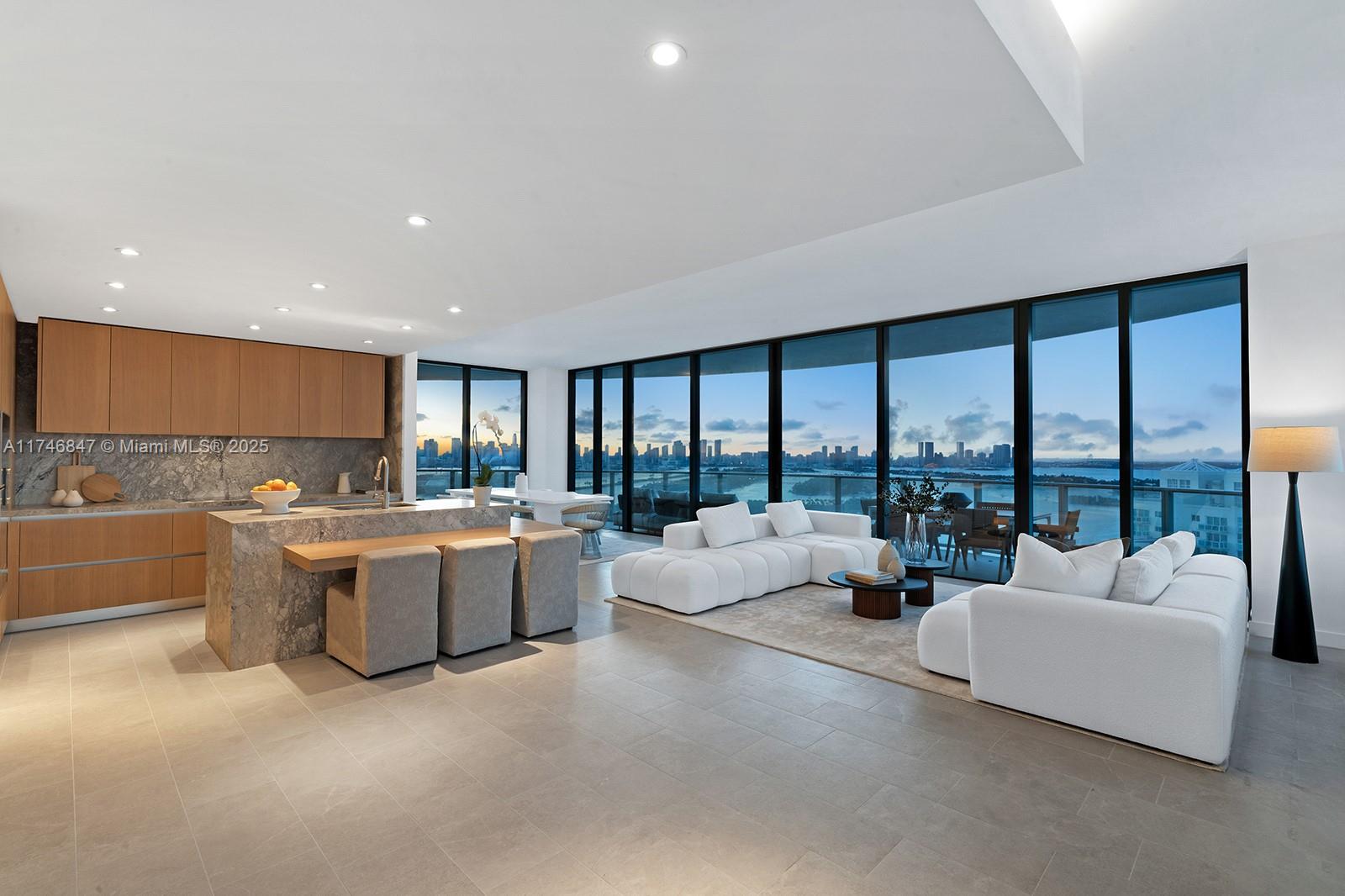 Step Inside with Me! This fully furnished corner residence at the brand new Five Park stuns with panoramic skyline, bay and ocean views. These never before lived in interiors by Gabellini Sheppard present a private elevator foyer, 10’ ceilings, expansive floor-to-ceiling windows, an oversized 1,000 SF wrap-around terrace and versatile den. A modern kitchen showcases Italian oak cabinetry, marble finishes, Gaggenau appliances, and breakfast seating complemented by a bright dining setting with city views. The primary features a dual vanity marble bath with shower + soaking tub and spacious closet. Situated in the Canopy section of the tower, this residence offers premium amenities including 2 pools, 2 fitness studios, spa, beach service & proximity to a brand new park and to South of Fifth.