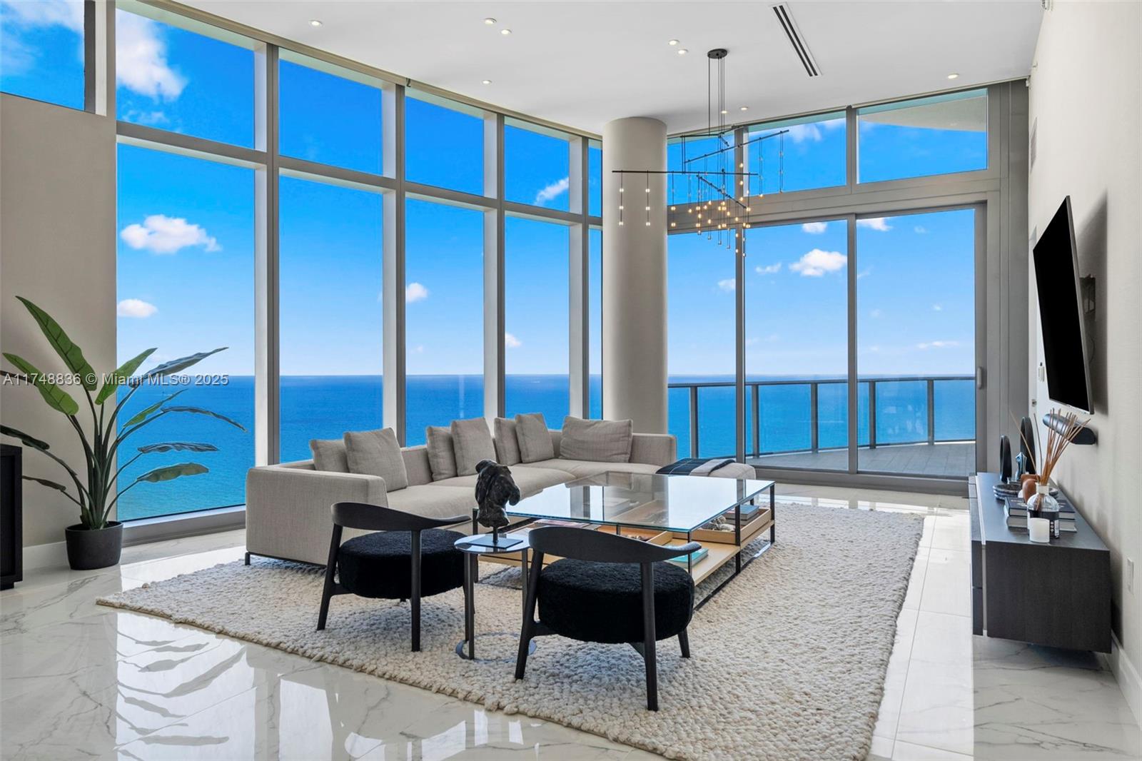 Panoramic ocean and city views from the 4701 floors at The Ritz-Carlton Residences Sunny Isles offers an unparalleled level of luxury. As you step off the private elevator into this breathtaking sky-high retreat, you will instantly recognize its distinction from anything else on the South Florida market. With 13-foot ceilings and expansive floor-to-ceiling windows. This property features 3 bedrooms, 4 1/2 bathrooms, a den, elegant marble flooring, built-in closets and window treatment. The Italian-designed gourmet kitchen is outfitted with premium Gaggenau appliances, a wine cooler, and a built-in cappuccino maker, seamlessly flowing into the oceanfront dining and living areas. Resort style amenities, restaurants, oceanfront pools, spa, gym beach full service, 24 house concierge service. �