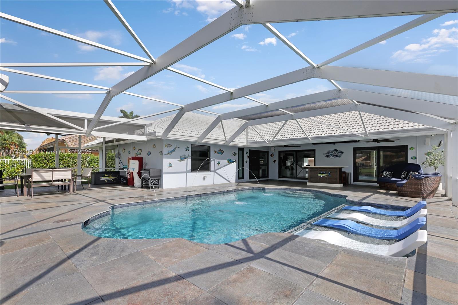 Spectacular custom home in gated Lakeview Estates!  Beautiful 4/2 pool home with an amazing lake front view.  Custom kitchen with large island, quartz countertops, custom cabinets, top appliances with Sub-Zereo refrigerator.  Open floor plan to all living areas with volume ceilings & custom wood wall features.  Bathrooms are beautifully updated! Primary bathroom includes a large free-standing tub. Primary bedroom over-looks the pool, with a walk-in closet & additional closets to the ceiling. Electric blinds. Breath-taking pool/patio looking onto the lake, with new pool surface, heated & cooled with salt-water system. Over-sized screening area, with hot tub, large dining area & a projector tv system! Impact windows & doors!
Check out the video & the attachment with more fantastic features!
