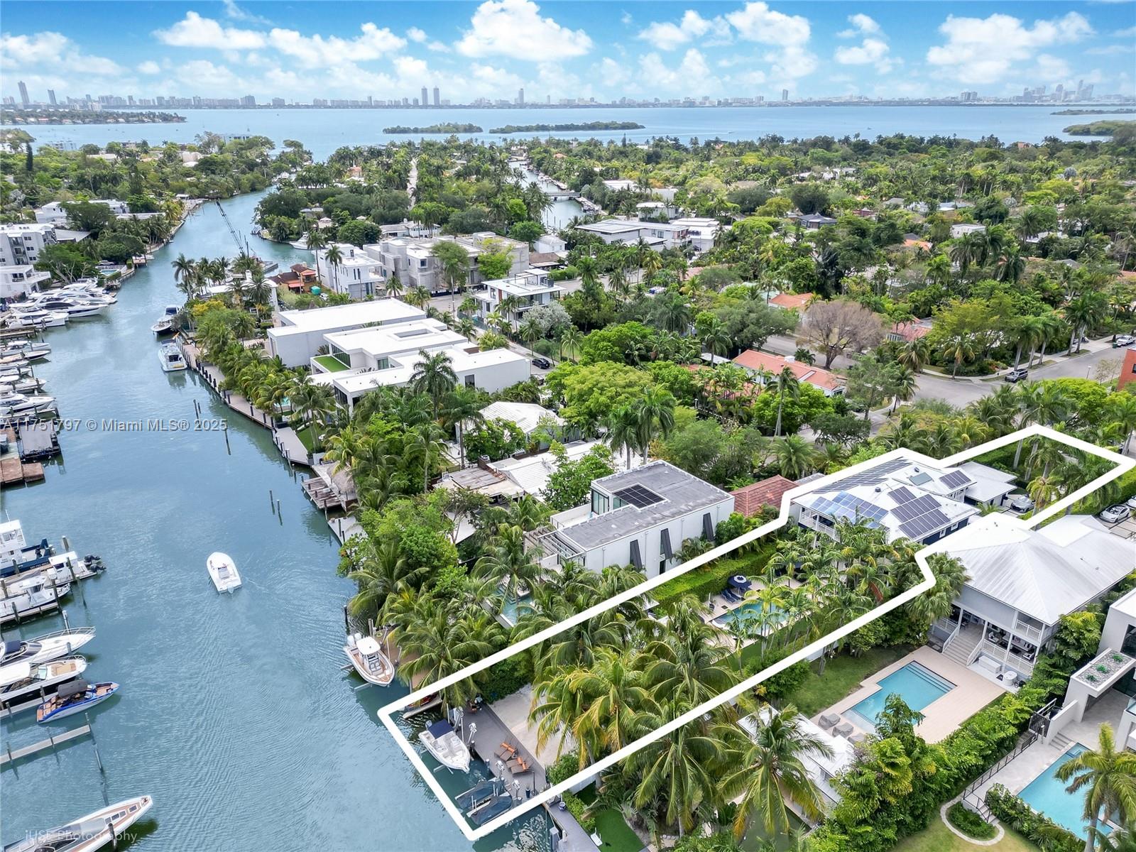 Renovated, elevated, and gated waterfront estate in guard-gated & patrolled Belle Meade with 6,093 Sq.Ft. total area. This 4BR/4BA home sits on a 17,350 Sq.Ft. lot, offering a deep waterway with no bridges to the bay. Highlights include an impressive 10-car motor court, 7.5-ft Pivot Entryway, 21-ft foyer, 11-ft ceilings, custom Wolf/Sub-Zero chef’s kitchen, indoor-outdoor wet bar, walk-in pantry, and backlit marble accents. Outdoors, enjoy a 40x15 heated saltwater pool, gazebo with outdoor kitchen & cabana bath, plus an elevated seawall & dock with boat & double Jet Ski lifts. Smart features include 77 solar panels (nearly 100% consumption), two new 5-ton AC units, a full-house generator, impact windows/doors, Lutron lighting, and a comprehensive security/entertainment system.