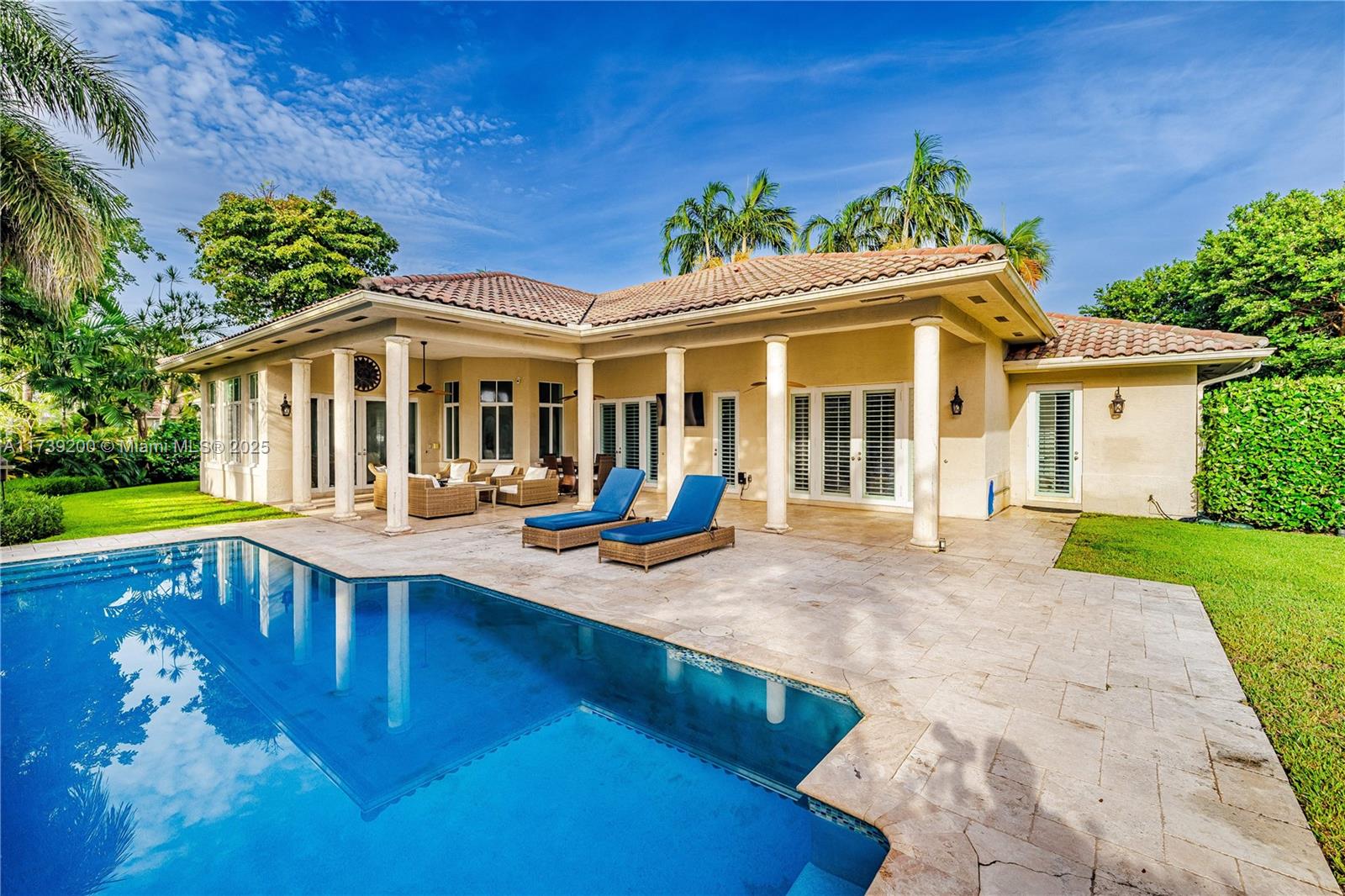 This home checks every box! Introducing this elegant, spacious & professionally decorated residence in the highly sought-after gated community, Flamingo Gardens. Inside, find an open/split floor plan w/ 4BD/3BA + office, spacious living areas, soaring ceilings, impact windows, travertine marble floors, formal dining, eat-in chef's kitchen w/ pantry & Sub Zero/Garland appliances, & French doors that open to a backyard oasis. The primary suite boasts a walk-in closet w/ custom cabinetry & a gorgeous bathroom w/ new dual vanities, shower & separate jacuzzi bath. Nestled on an oversized 15,180SF lot, this home offers lush, manicured landscaping, a stunning pool, covered 1,000SF patio, Al Fresco dining, & a 2-car garage w/ epoxy floor. The side yard is gated & has ample space for boat storage.