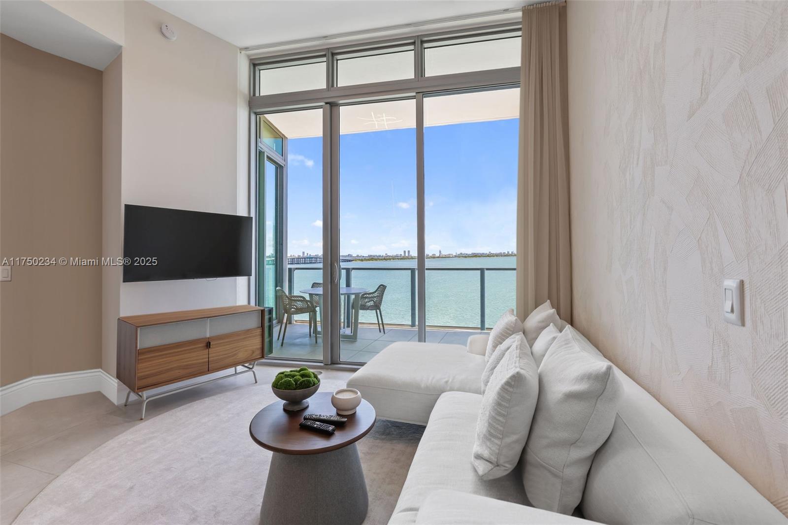 Experience luxury living in Edgewater’s most prestigious residence, offering unobstructed Miami Beach skyline and Biscayne Bay views. This fully furnished 2-bed + den, 3-bath condo features 10-ft floor-to-ceiling impact windows, a private foyer with elevator access, and top-tier Miele appliances. Indulge in resort-style amenities: a pool deck with cabanas, beach club, spa, gym, tennis, basketball, business lounge, kids’ playroom, dog park, and 24/7 concierge. Ideally located near Miami’s top dining and entertainment. Property is vacant.