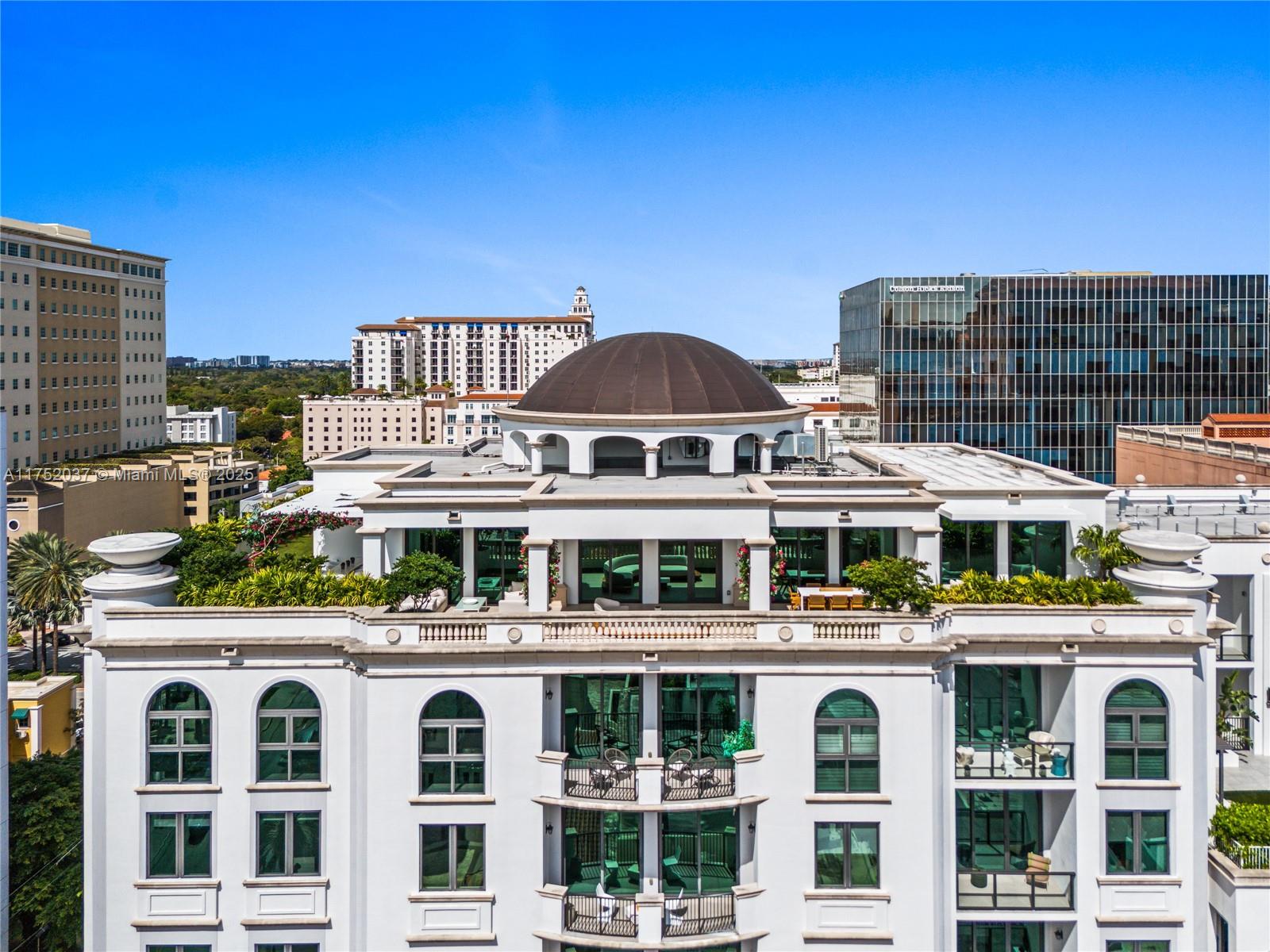 Buy new construction without the wait! This luxury full-floor penthouse in Coral Gables offers 5,000 sq ft of elegant interiors and a 5,000 sq ft wraparound garden terrace with 360 views. Features a private elevator foyer, 11+ ft ceilings, floor-to-ceiling glass, and European oak floors. This 4-bed,4.5-bath includes a primary suite with a den, massive closet space ready for customization and stunning bathroom with three rainfall showers. All rooms have terrace access and en-suite baths. High-end finishes include Subzero/Wolf appliances, Melamine cabinetry, 8’ wood doors, pre-wired AV, and Lutron lighting. Developer ready to build a custom summer kitchen for the buyer to create a tropical oasis and enjoy Florida living. A true 'House in the Sky,' this PH comes with 4 parking spaces.