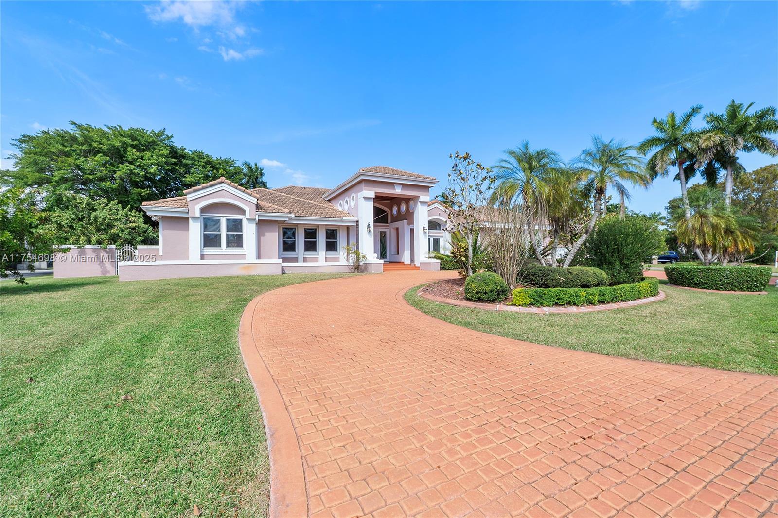 Your next chapter starts in this spacious 5 bed, 4 bath corner lot home! Double doors welcome you into the foyer, with views of the pool from the formal living & dining areas. The chef’s kitchen features s/s appliances, center island, walk-in pantry & breakfast nook leading to the family room & fireplace. The primary suite is designed as a private retreat with sitting area, his & hers closets & spa like bathroom with soaking tub, separate shower & double sinks. Step outside to your fully fenced outdoor oasis with covered patio, screened-in pool, heated spa & half basketball court, ideal for year round enjoyment. Other highlights include: high ceilings, laundry room, two car garage, impact windows, new A/C units. Near Deering Estate, this home truly offers the best of Palmetto Bay living.