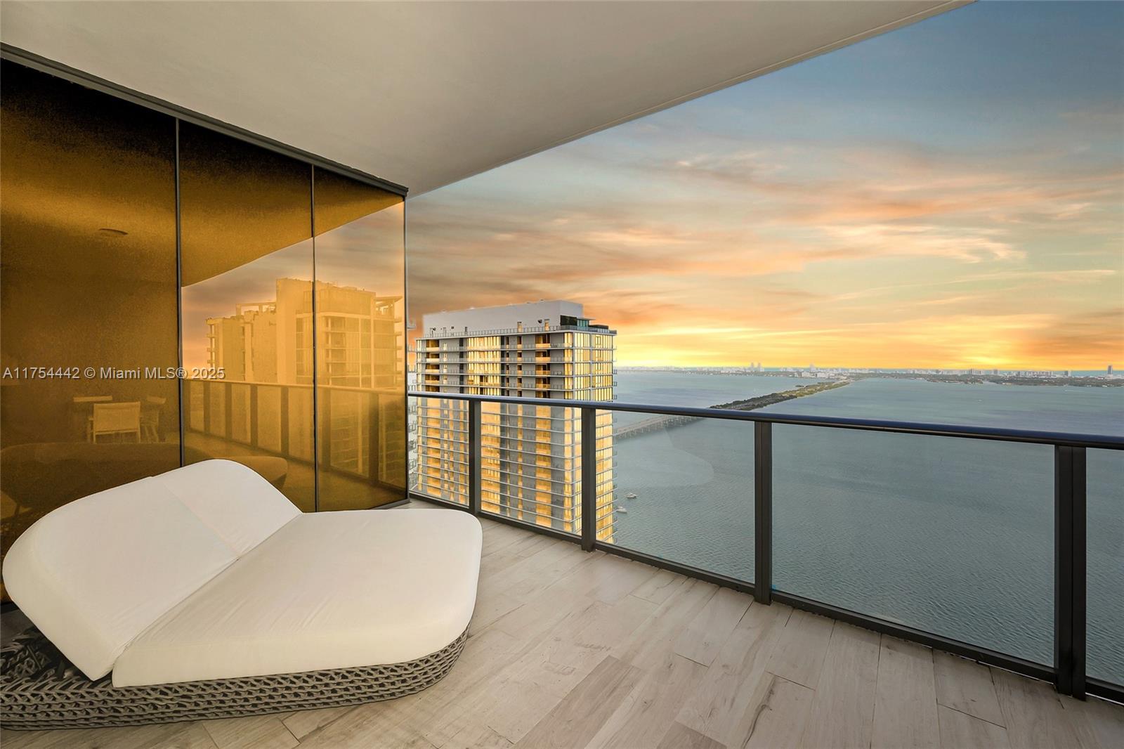 Welcome to this stunning 48th-floor residence at Gran Paraiso, offering unparalleled oceanfront living. This 2-bed, 3-bath condo features contemporary design and panoramic views, providing a serene sanctuary with unobstructed vistas of the Atlantic Ocean and Biscayne Bay—ideal for breathtaking sunrises and sunsets. The open-concept layout is filled with natural light from floor-to-ceiling windows. The chef-inspired kitchen boasts upgraded appliances, sleek cabinetry, and stylish countertops. The master suite offers ocean views and a luxurious en-suite, while the second bedroom has its own private bath. Resort-style amenities include a pool, fitness center, and tennis courts. Located in vibrant Edgewater, just minutes from Wynwood, the Miami Design District, and Brickell.