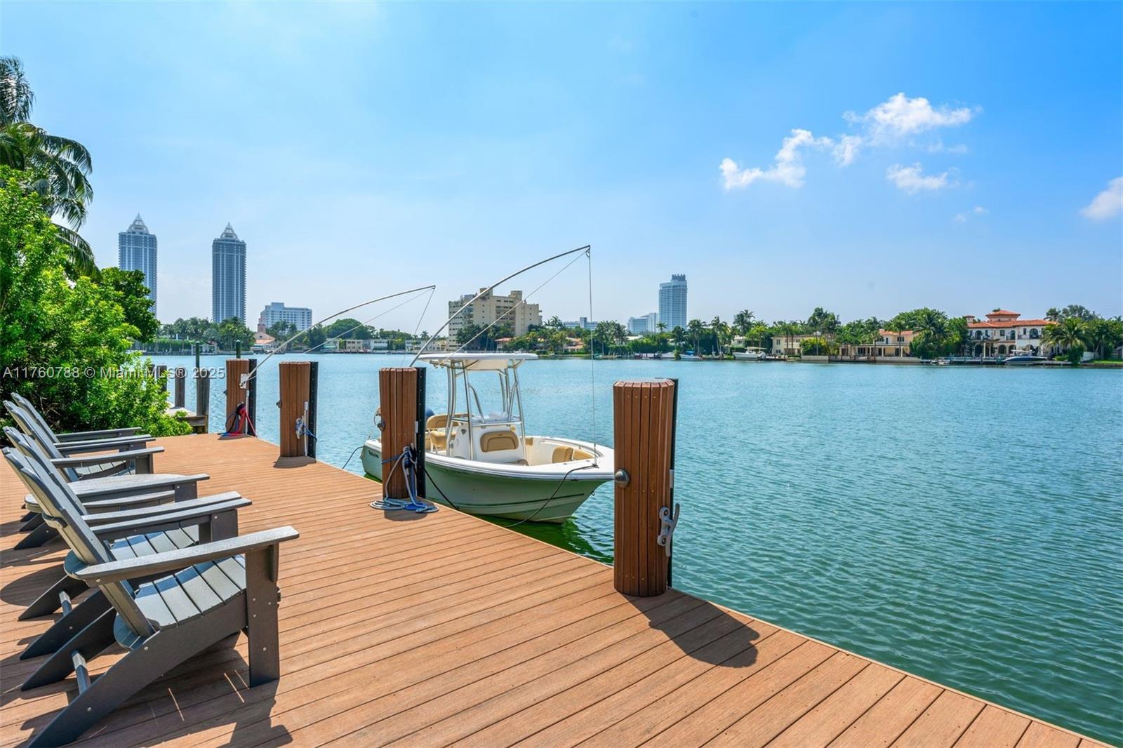Experience the pinnacle of waterfront living in the highly coveted Lakeview Neighborhood, nestled along the wide side of the sought-after Surprise Lake. This is a rare opportunity to expand the current home or build your dream waterfront retreat on a stunning 14,000+ sq. ft. lot, boasting 70 feet of water frontage. Designed with true waterfront living in mind, the property features a recently constructed boat dock and lift. The backyard is an entertainer’s dream, complete with a fully equipped Tiki Hut and all the amenities needed to create unforgettable memories with friends and family. The living spaces are bathed in natural light, offering breathtaking lake views through impact windows and doors. The home is fully automated with Control4, ensuring ease and convenience throughout.