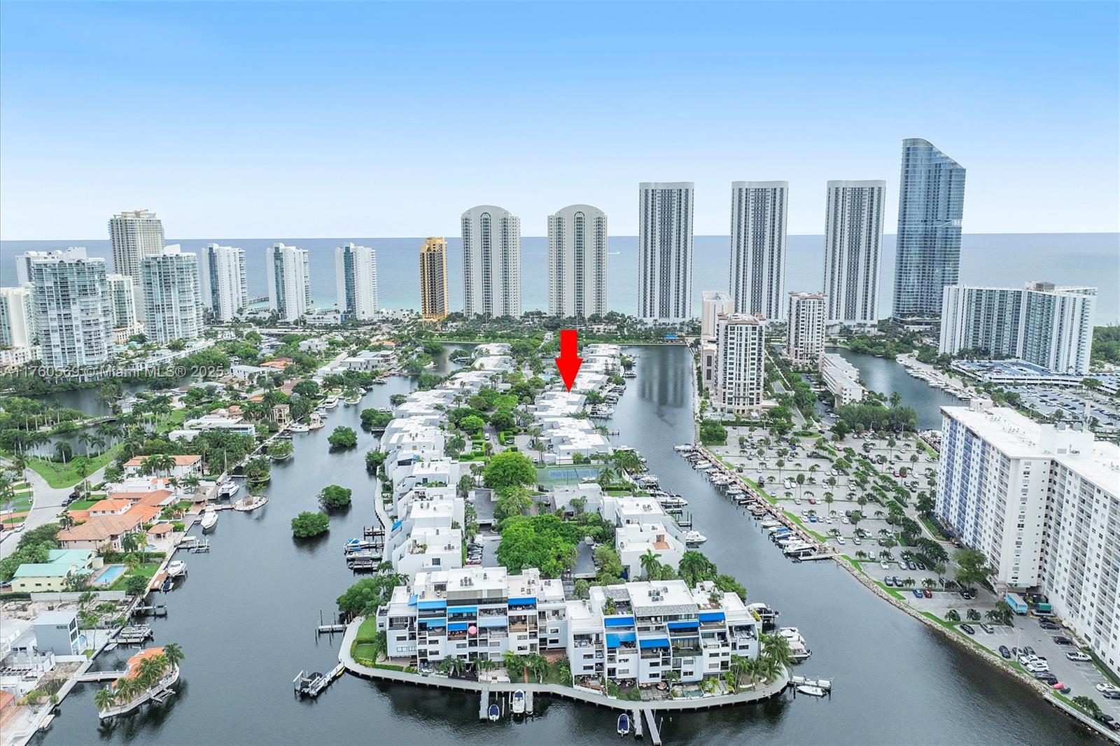 Welcome to your dream waterfront retreat with a 43’ boating dock in the exclusive Poinciana Island Yacht & Racquet Club! This stunning 4 bed, 3 bath corner townhome boasts 2,650 sq ft of bright, airy living space. Enjoy picturesque water views from your spacious backyard complete with the luxury of docking your Yacht on your deeded boat dock. Boaters will enjoy direct ocean access without bridges and within 10 minutes reach the Haulover Sandbar and inlet, with the islands of the Bahamas within a few hours reach. One bedroom is located on the first floor, perfect for guests or easy accessibility. Additional highlights include a large pantry, impact glass windows and doors, new electrical panels, a patio with a spa for outdoor enjoyment and an attached garage.