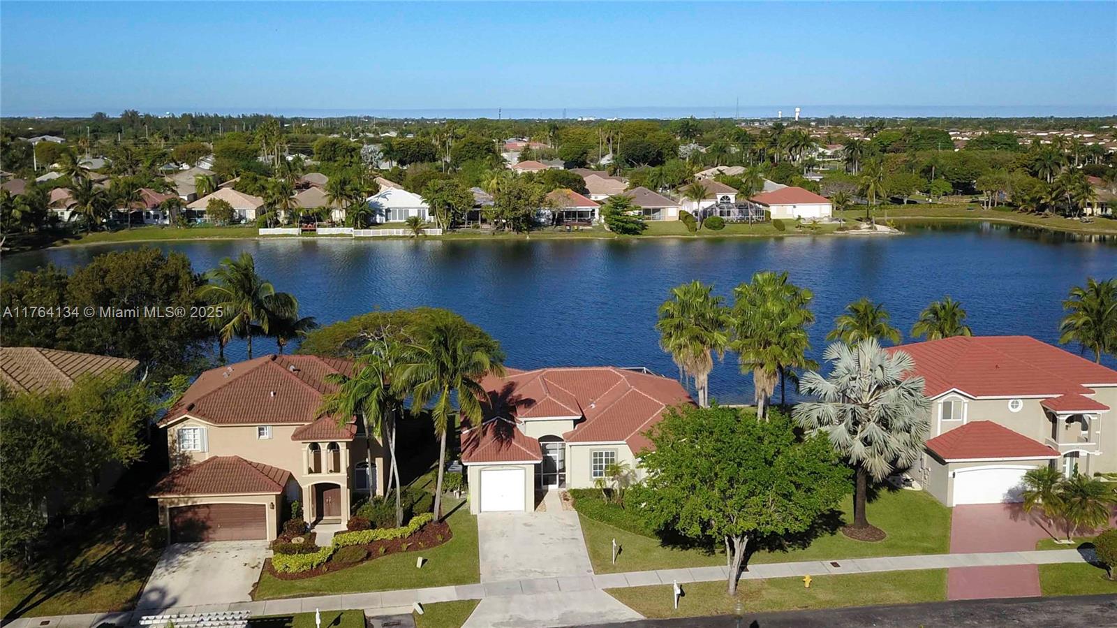 Location, location, location. Stunning lake views from this beautiful 4 BR/ 2 BA home in the gated community of East Lake at Keys Gate. Freshly painted, tile and laminate floors throughout, new ac, new roof and large screened terrace to enjoy your morning coffee or catch the perfect sunsets. The large backyard overlooks the serene lake, providing a peaceful retreat. Nestled near the Florida Keys, this home offers tranquil lakeside living while being close to shopping, dining, and major roadways. Seller open to contributing $10,000 towards buyers closing costs and/ or an interest rate buy down. Perfectly maintained. Do not miss this opportunity. Must see!