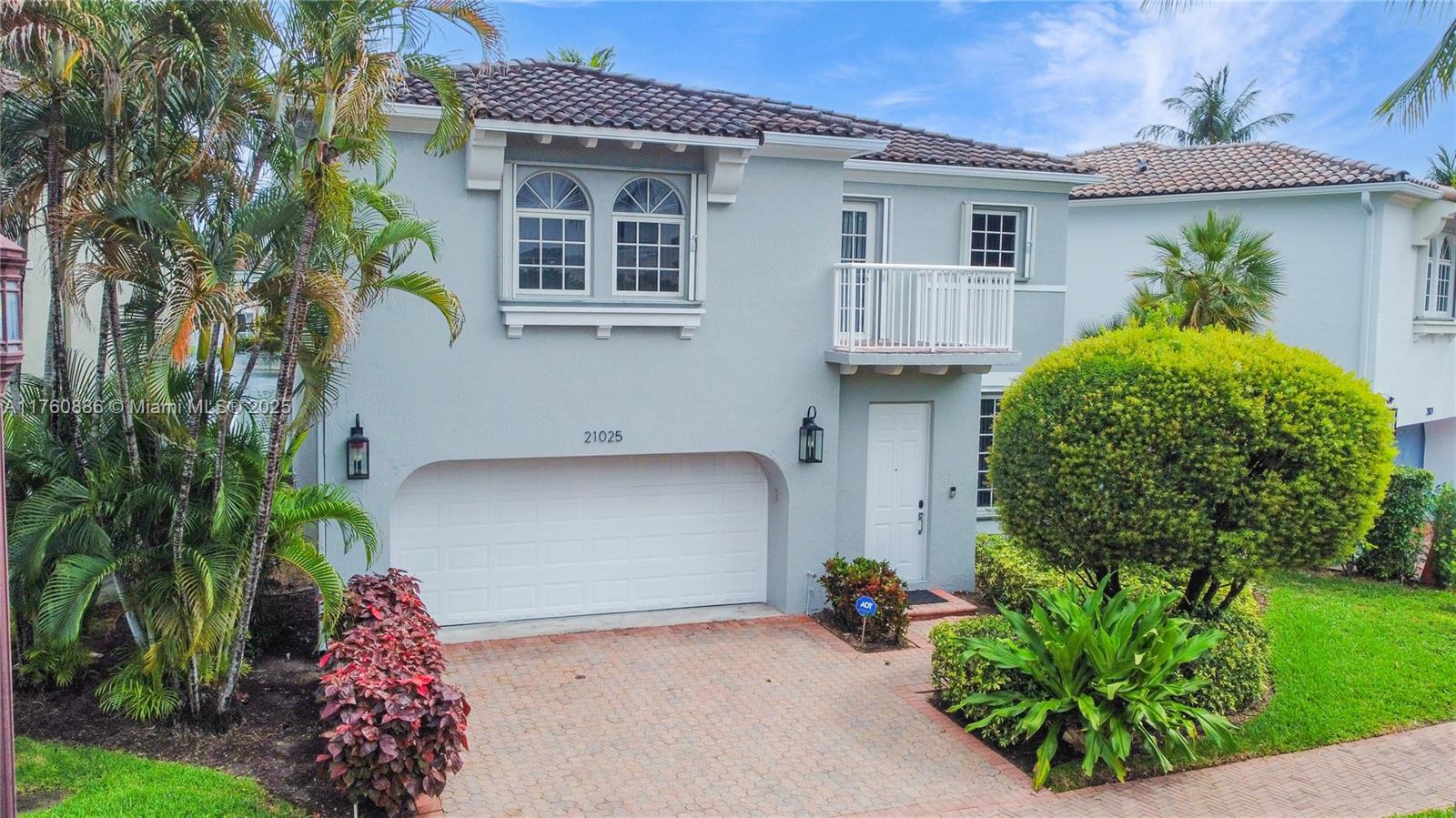 Welcome to this 3-bedroom, 2-bathroom home in prestigious gated community of Aventura Lakes. A unique location, with views overlooking a serene canal and fountain. Offering over 2,200 sq. ft. of living space, this residence features tile flooring throughout the first level and wood flooring on the second level. The primary suite boasts a large walk-in closet with built-in cabinetry, additional bedrooms also offer custom-built storage. A full-size laundry room, and accordion hurricane shutters provide peace of mind. Home is within walking distance to Chabad and Charter Sofer High School. Amenities including two swimming pools, gym and more. Great home with 24/7 security, on-site management, and a prime location near top-rated schools, world-class shopping, dining, and beautiful beaches.