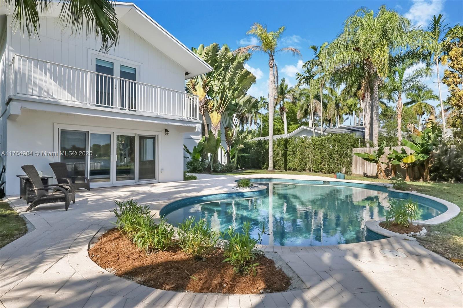 Stunning Lakefront Pinecrest Home. Start your day with a peaceful morning coffee poolside while the sun rises over the serene waters of Lake Sheldon. This beautifully updated contemporary home rests on a spacious, lushly landscaped waterfront lot, offering a blend of tranquility & elegance. The open-concept design features soaring ceilings & expansive windows flooding the interior w/natural light. This home offers a family room for gatherings, a kitchen pantry, walk-in closets providing ample storage, a carport w/an EV charger, & impact windows for peace of mind/energy efficiency. Whether you’re swimming, fishing, canoeing, or enjoying small boating on the Pinecrest waterway, this home offers many options for outdoor recreation & relaxation w/family & friends.