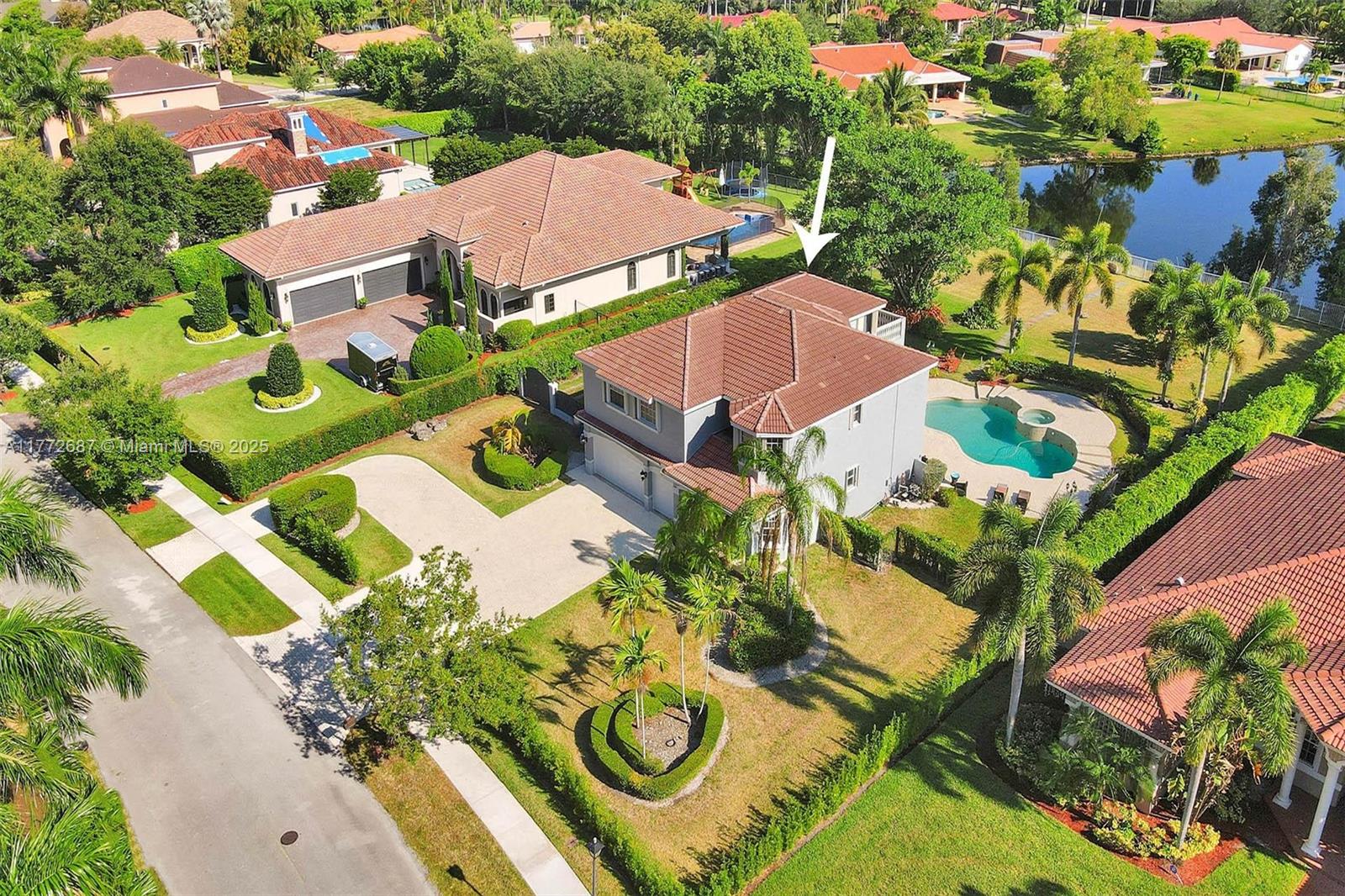 Welcome to your dream estate in the heart of Weston! Situated on a builder’s acre with tranquil lake views and expansive green space, this beautifully maintained custom home offers comfort, elegance, and functionality.  NEW elevator, this residence is thoughtfully designed with high ceilings, formal living and dining areas, and an open floor plan perfect for gathering. Step outside to your private oasis, complete with a resort-style pool, spa, and lush landscaping—ideal for relaxation or entertaining. The first floor includes one bedroom and full bath, perfect for guests or home office use. Upstairs, the oversized primary suite opens to a large balcony with breathtaking views. 3-car garage, and a circular driveway complete this exceptional home. 
Call today to schedule your private tour!