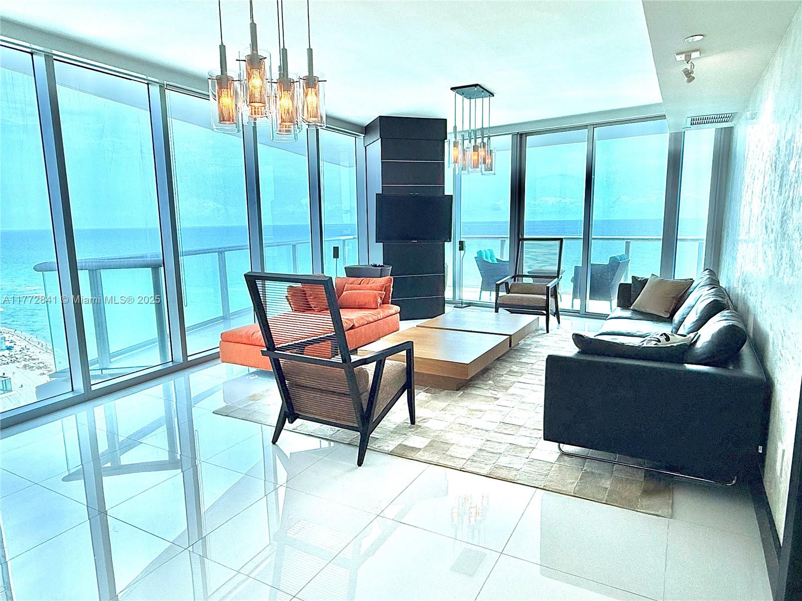 Experience unparalleled elegance in this stunning 4-bedroom, 4.5-bathroom residence at Jade Beach, one of Sunny Isles Beach's most prestigious oceanfront condominiums. Perched on the 25th floor, this sophisticated unit boasts floor-to-ceiling windows, offering breathtaking panoramic ocean and city views. The spacious open-concept layout is enhanced by high-end finishes, Italian cabinetry, top-of-the-line appliances, and smart home technology. Step onto the private balcony to soak in mesmerizing sunrises over the Atlantic. The primary suite is a serene retreat, featuring a spa-like bathroom with a soaking tub, glass-enclosed shower, and dual vanities. Jade Beach offers world-class amenities, unit comes Fully Furnished, with 2 parking spaces + storage