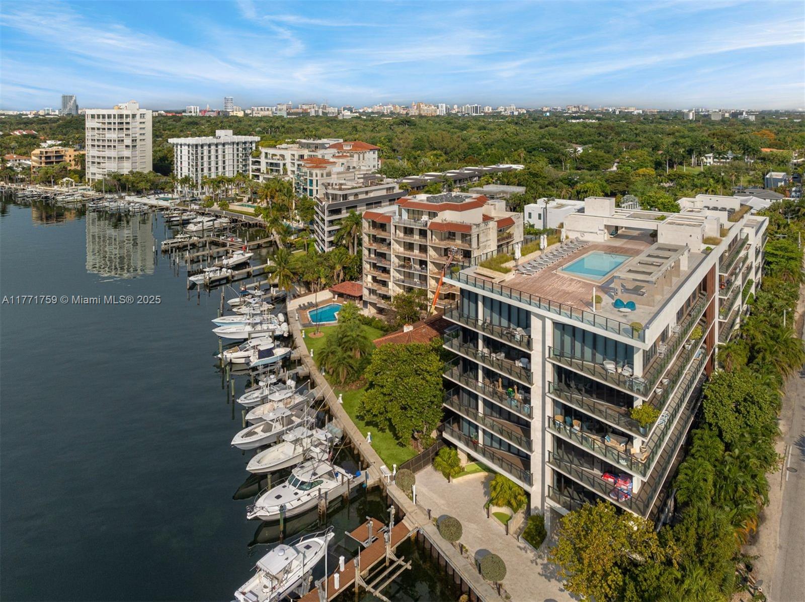 Sophisticated 3-bed, 3.5-bath residence at The Fairchild Coconut Grove, a boutique waterfront enclave by acclaimed architect Max Strang. This corner home offers limestone floors, soaring ceilings, recessed lighting, and a wraparound terrace with unobstructed bay and ocean vistas. The chef’s kitchen features a large island, black marble countertops, custom cabinetry, and premium Wolf, SubZero, and Asko appliances. Entertain effortlessly with a sleek wet bar and SubZero wine cooler. The luxe primary suite boasts dual marble vanities, a walk-in closet with custom built-ins, soaking tub, and glass-enclosed shower. Includes Maytag washer and dryer. Exclusive amenities: rooftop pool, spa, gym, and 24-hr concierge.