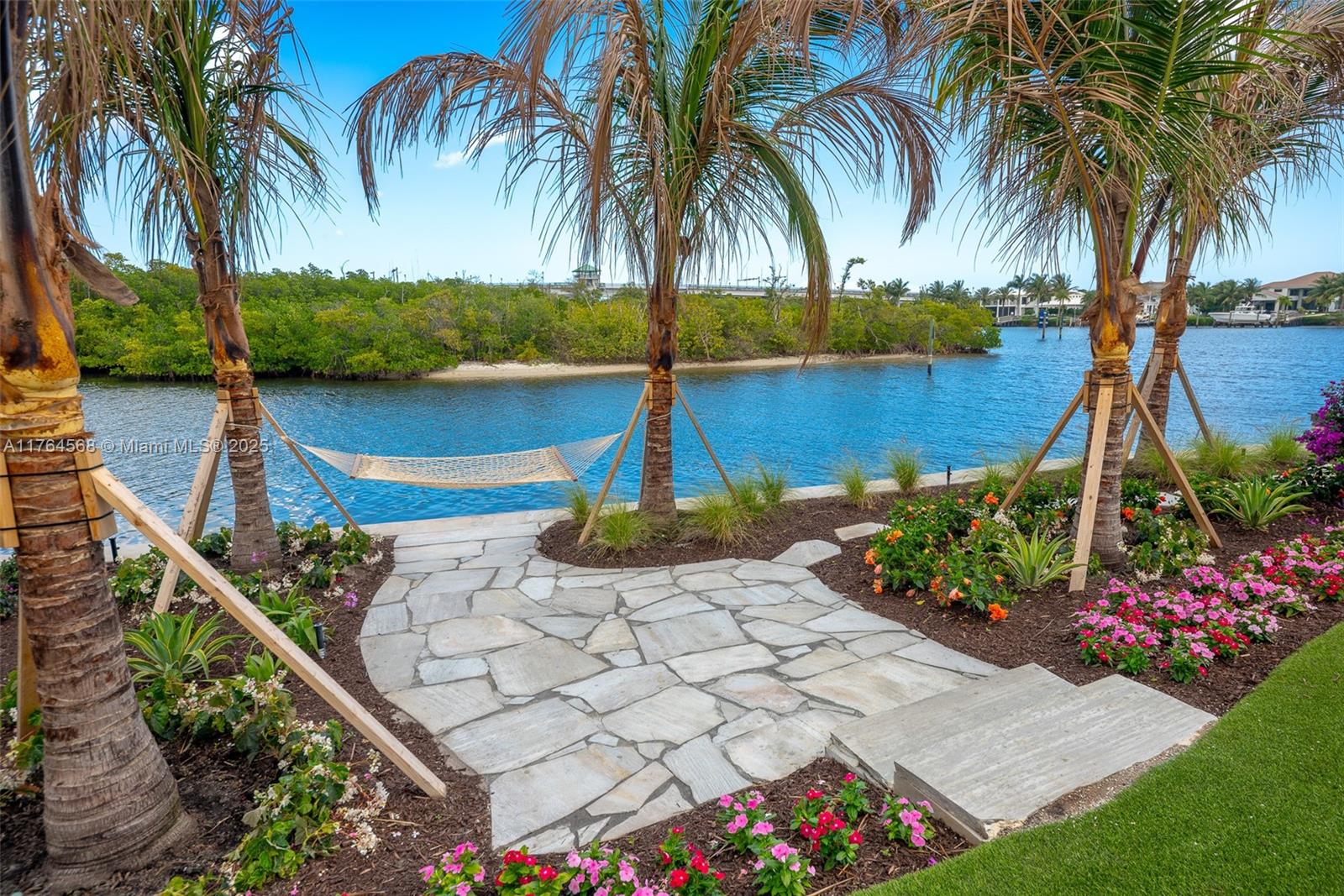 Nestled in an exclusive waterfront enclave, this beautifully updated home offers access to vibrant marine waterways. Ideally situated, it provides both seclusion and proximity to world-class amenities.
This 4 BD, 4.5 BA residence features hurricane-impact glass, solid concrete construction, and a full-house generator. A new dock with a 24K lb lift accommodates boats up to 40 feet and a jet ski.
Inside, natural light floods expansive living spaces, blending elegance with modern luxury. A gourmet kitchen, custom bar, and soaring ceilings create a refined yet inviting atmosphere. Outdoors, the pool and spa overlook the waterfront preserve, offering ultimate privacy.
A rare opportunity to own a private waterfront sanctuary where luxury and convenience converge!
