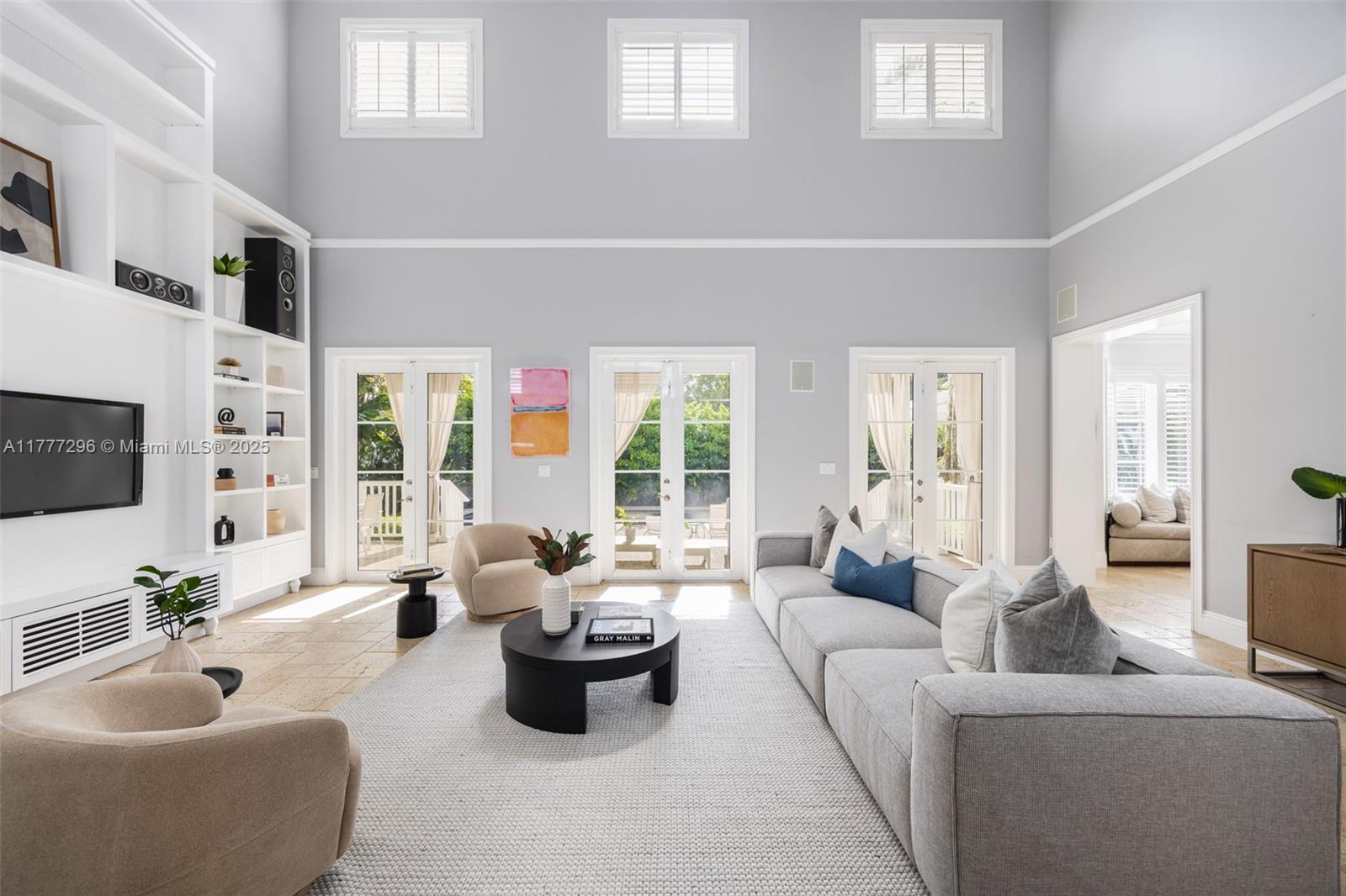 Built in 2005 and spectacularly updated, this stunning home features a fully renovated Chef's kitchen and a spacious, well-designed floor plan that blends comfort + style. Perfectly positioned on one of Pinecrest's loveliest streets, this property features incredible outdoor living spaces, including pool, spa, summer kitchen, cabana bath, and lush green spaces. Inside, you'll find two bedrooms on the first floor, while the second level hosts four additional bedrooms—including an expansive primary suite with two walk-in closets and a spacious sitting area. High ceilings, renovated laundry room, a two-car garage, and space for an elevator add to the home's exceptional features. Zoned for top-rated Palmetto schools, this home is a must-see!