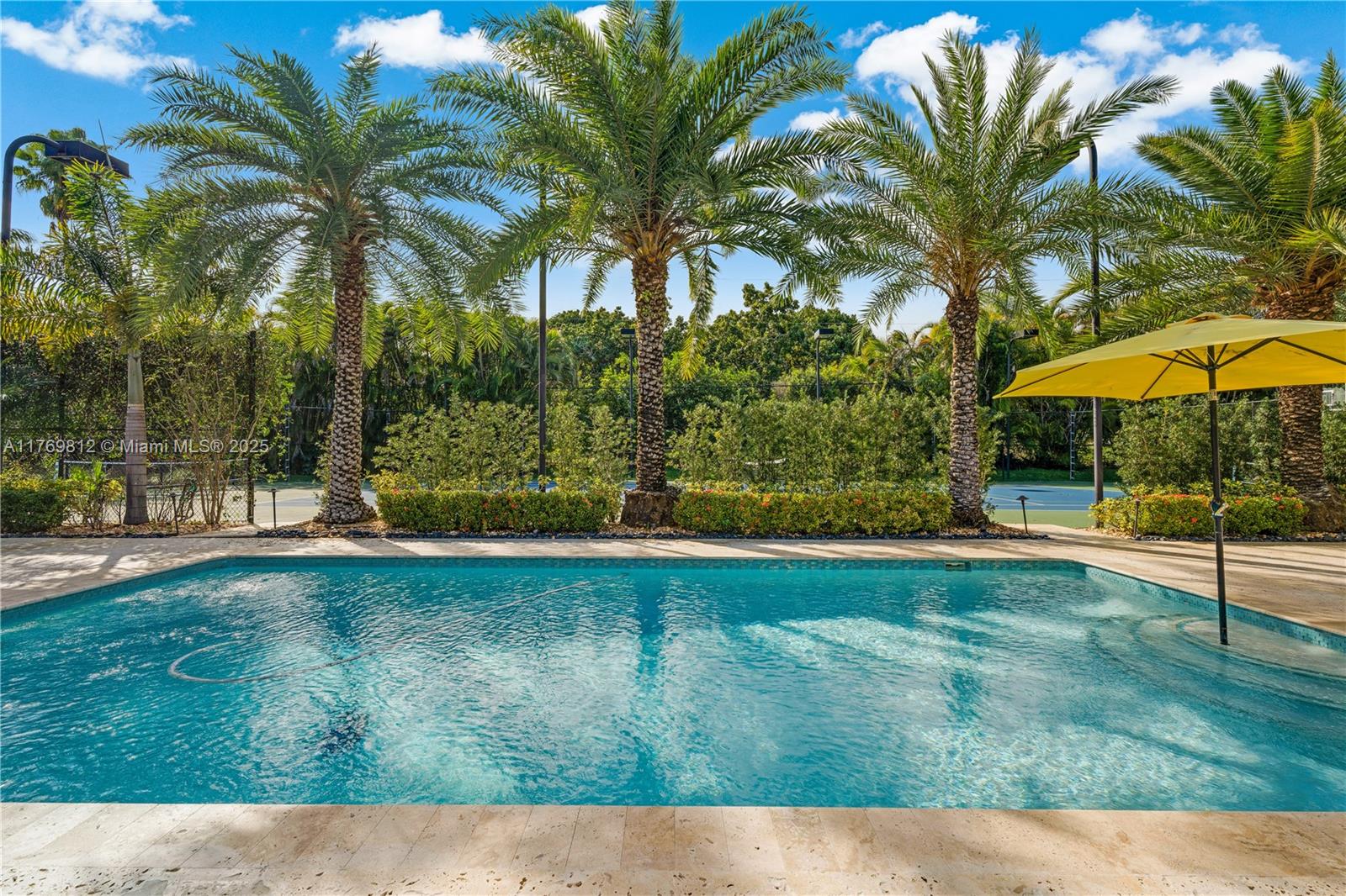 Welcome to this lovely Pinecrest property that sits on a very calm tree-lined street on a builder’s acre. The main house has 4 bedrooms and the guest house is fully equipped with a kitchen and office. Each house has an open layout and offers lots of bright light and beautiful views of the resort-like backyard. The outdoor is spectacular for entertaining and sports. The tennis court is also set up as 2 pickleball courts, on the side of the property sits a golf putting green, a large area to kick a ball, and a fire pit outdoor seating area. Don’t miss out on the opportunity to live in a resort in east Pinecrest!!