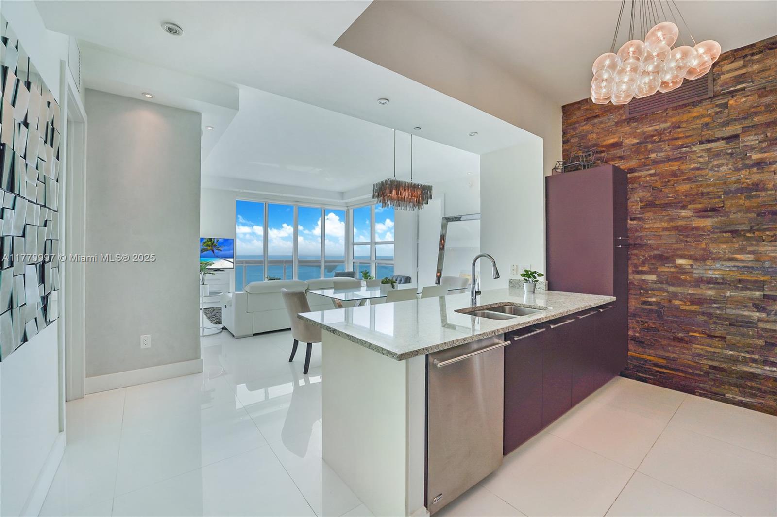 Step into a realm of elegance and light in this stunning 48th-floor condo, where high ceilings and expansive windows showcase mesmerizing views of the endless Biscayne Bay. This luxurious 2-bedroom, 2-bathroom split-floor-plan unit has been tastefully remodeled with upscale features like gleaming glass porcelain tile, chic wallpaper, stone accent walls, and sophisticated lighting. Indulge in fully customized walk-in closets, surround sound wiring, and thoughtful design details throughout. Nestled in the heart of Brickell, enjoy world-class amenities, assigned parking, and unmatched walkability to the vibrant and trendy spots that define this iconic neighborhood. Live the ultimate urban lifestyle!