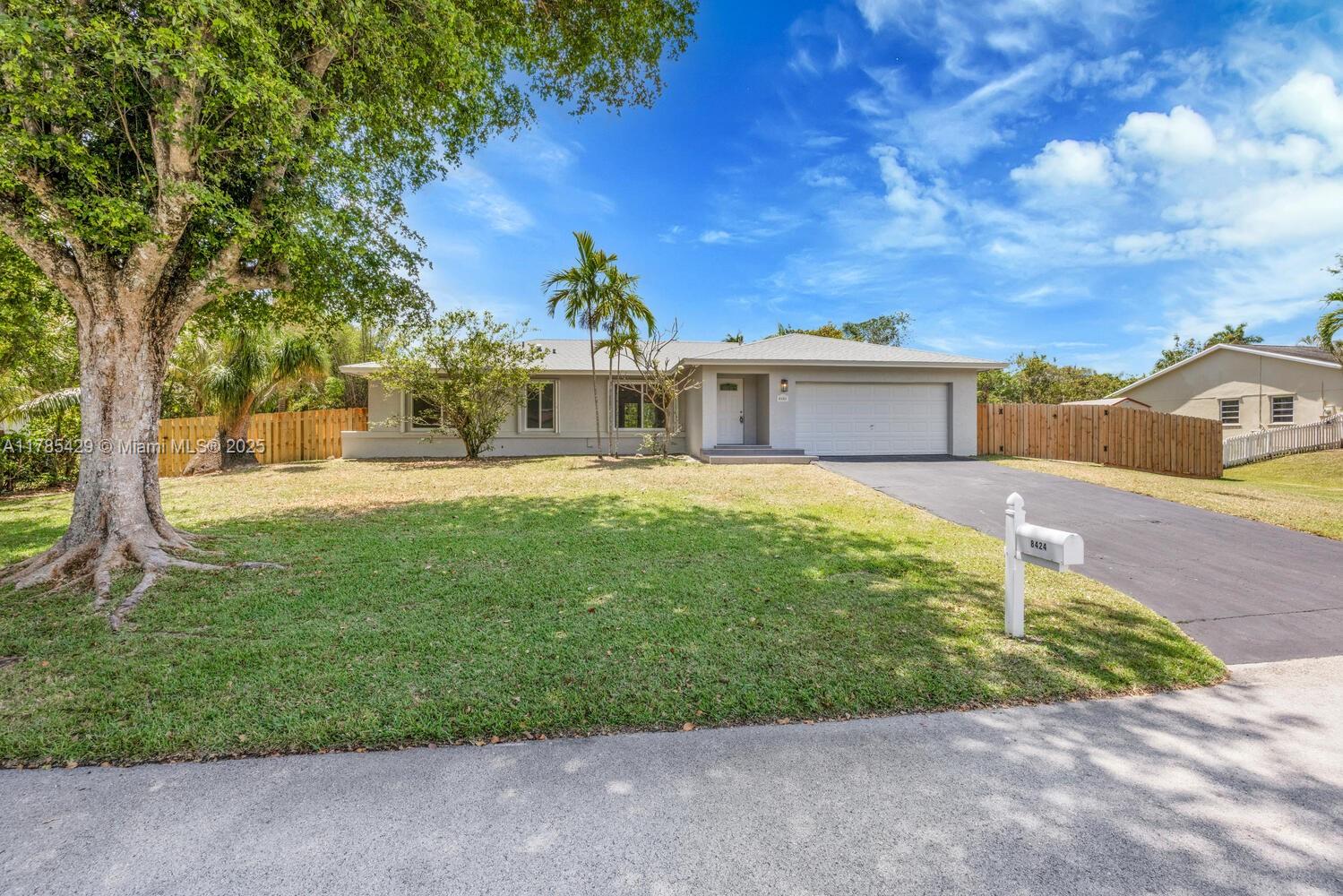 This home is a true TEN “10”! Nestled towards the end of a peaceful cul-de-sac, this stunning canal-front property has been completely remodeled with high-end finishes throughout. Featuring elegant wood-like flooring, a brand new AC unit, and abundant natural light, the home offers both style and comfort. Enjoy a formal living and dining area, along with a cozy family room that opens to a bright white kitchen with quartz countertops and brand-new stainless-steel appliances. All bedrooms are located on one side, each with spacious closets. Impact French doors lead to a large, fully fenced backyard with a convenient storage shed. The two-car garage includes a new washer and dryer. Accordion hurricane shutters for all windows. Plenty of room to park your boat, RV, trailer, and other toys!