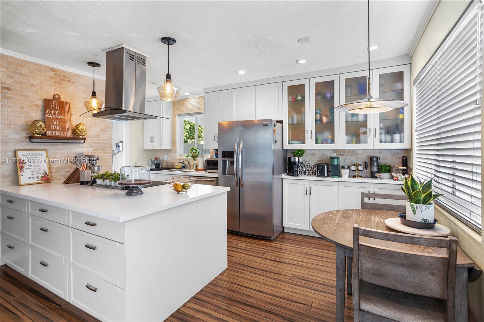 This NON HOA  fully remodeled 3-bed home near Whispering Pines features an open layout, white quartz kitchen with island, bamboo floors, and extra room—ideal for office, playroom, or 4th bed. Newer roof (2022), Impact Windows (2024),HVAC (2023),Electrical (2020), Plumbing (Drain Pipes 2015) Instant water heater. Huge fenced yard with newly installed deck, shed, boat parking, and mango tree! No HOA. Room for a pool. Perfect as a rental or your forever family home.