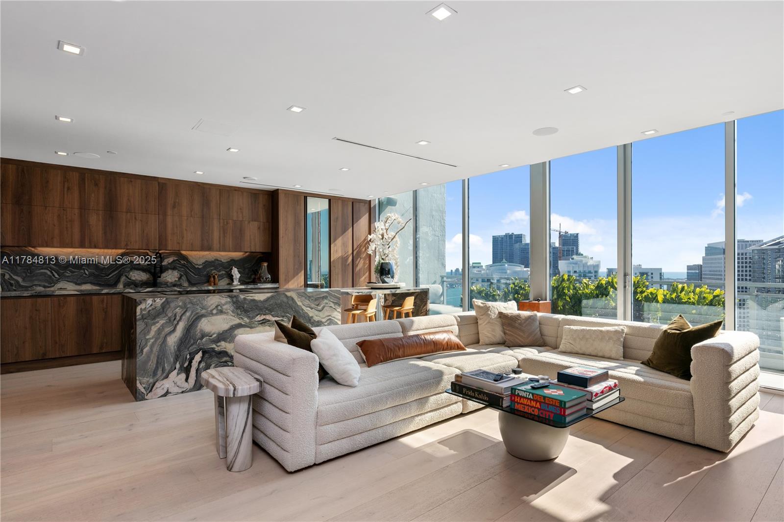 Welcome to Penthouse 14 at The Ivy, a renovated masterpiece overlooking Miami. This is not just a penthouse, it is a statement. From the moment you enter, you are greeted with unparalleled views of Brickell, Biscayne Bay and the Miami River through floor-to-ceiling windows. Every detail has been redesigned with RIVA European oak flooring, a smart home system and automated privacy glass. What makes PH-14 unique? A private rooftop oasis with outdoor kitchen, BBQ, seating for 10+ people and outside TV, all framed by stunning views. Do you need shade? Automated canopies deploy with the push of a button. Located in the gated Riverfront community with 24/7 security, you're steps from Brickell and world-class restaurants, but with complete privacy.