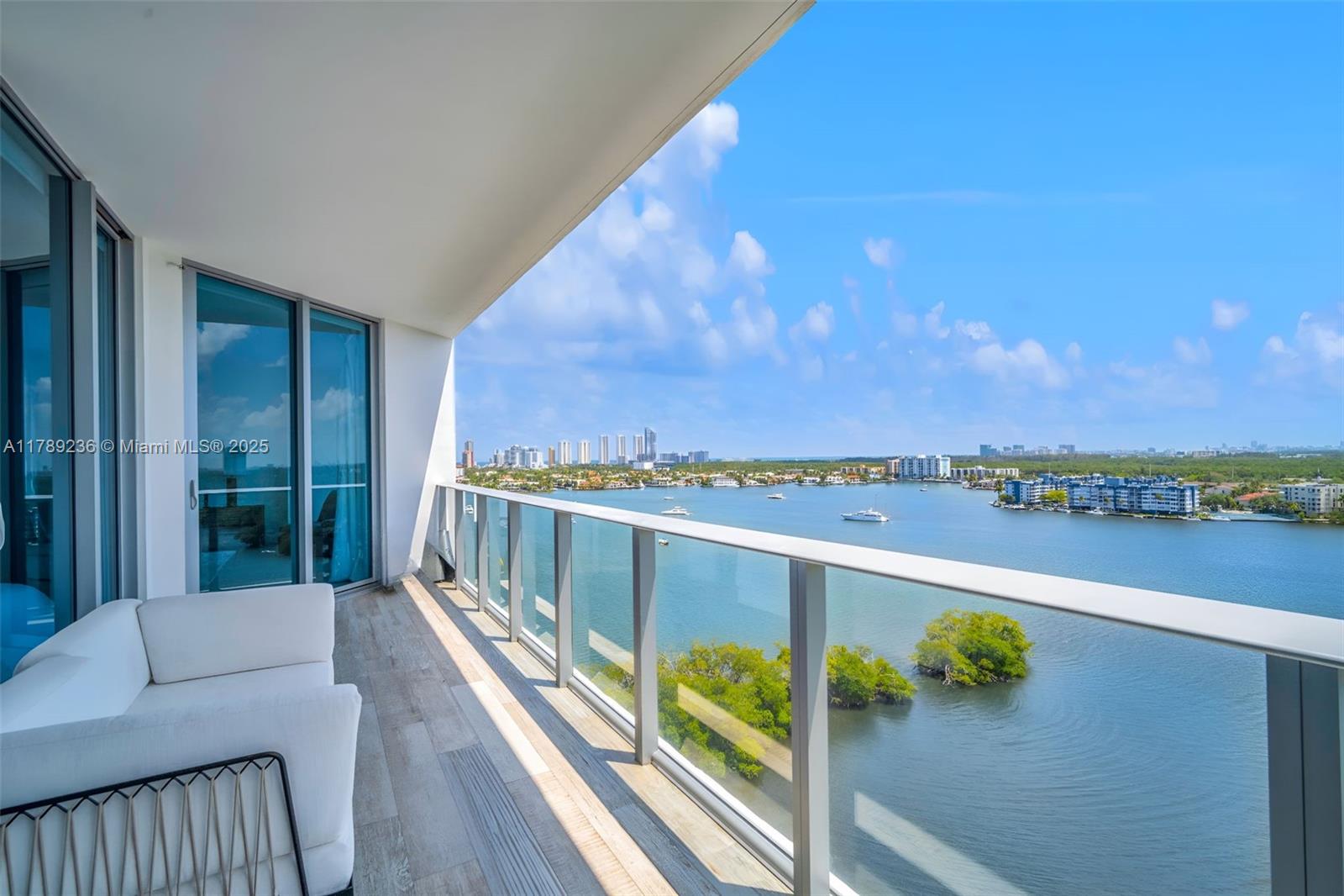 Experience luxurious living in this exquisite high-floor residence featuring 4 bedrooms and 4 baths, all while enjoying stunning views of the Intracoastal Waterway and a tranquil nature reserve. The spacious layout includes a European-style kitchen outfitted with top-of-the-line SubZero and Wolf appliances, complemented by smart lighting, electric shades, and an advanced audio-visual system, easily controlled via touchscreen or smart remote.
This unit also offers two dedicated parking spaces and additional storage. Residents can indulge in exceptional amenities, including a state-of-the-art fitness center, a relaxing spa, an infinity-edge pool, and access to a private marina. Conveniently located just minutes from Aventura Mall, Sunny Isles Beach and Bal Harbour.