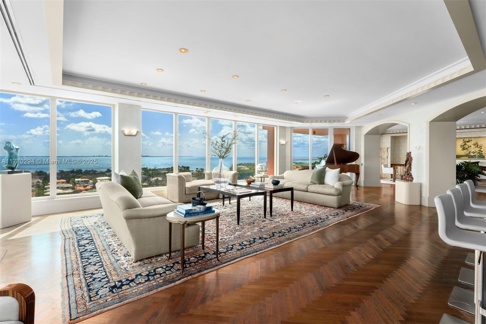 Discover refined elegance in Unit 16K of the Gables Club, a 5,230 SF masterpiece designed by Holmes Newman. Enjoy panoramic views of Biscayne Bay from two open balconies in this 3-bedroom, 4.5-bath residence, with an office, an additional room that can be turned into a fourth bedroom, a recreation room, a private elevator, grand foyer with custom dome ceiling, and expansive living areas adorned with herringbone wood floors. The gourmet kitchen boasts a center island, Sub-Zero and Miele appliances and a butler’s pantry, and the primary suite has dual marble bathrooms and walk-in closets. Gables Club amenities include 24-hour concierge, heated pools, spa, fitness center, tennis courts, marina, and a private restaurant. Includes two assigned parking spaces and private storage.