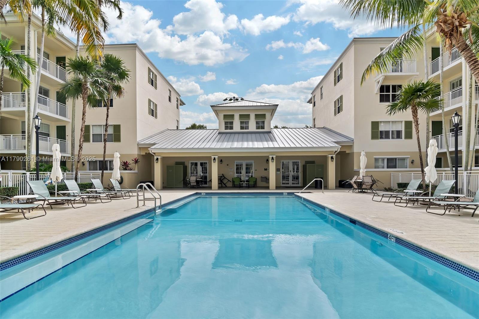Beautiful 3 bdrm, 2.5 bath condo in the gated community of Pinecrest Reserve. Lovely kitchen with breakfast nook and pass through to the spacious living/dining room. Half bath off the living area. Tile flooring in living area, carpet in bedrooms. Split bedroom floor plan. Generously sized primary suite with walk in closet and bath with double sinks, shower and separate soaking tub. Laundry room. Guest rooms have built-in closet cabinetry. Tropical garden view from the oversized balcony with plenty of space for a table and chairs for dining, al fresco! Fantastic amenities include swimming pool, spa, fitness center and community room. 2 covered, assigned parking spaces plus guest parking. Well located, minutes from the shops at 104th, the Palmetto Expressway, Dadeland.