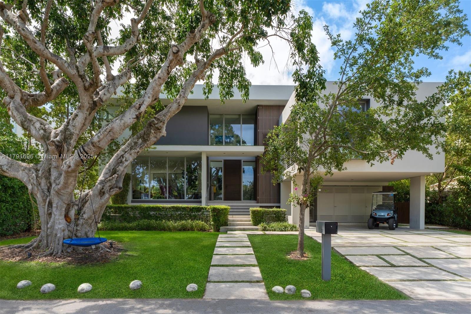 Built in 2020, this gorgeous residence is located on a quiet street on the exclusive paradise island of Key Biscayne. Designed with a sleek, modern, elegant and sophisticated open layout, this very comfortable home offers 6 spacious bedrooms and 5.5 beautiful bathrooms. Set on an 8,250 sq ft lot with 3,850 sq ft under A/C, it features soaring ceilings, exquisite high-end finishes throughout, and walls of glass that flood the interiors with natural light, creating a seamless blend of indoor and outdoor living. The expansive terrace, resort-style pool, and fully equipped summer kitchen offer the perfect backdrop for unforgettable gatherings surrounded by lush landscaping. A convenient carport and generous driveway parking make this home simply perfect.