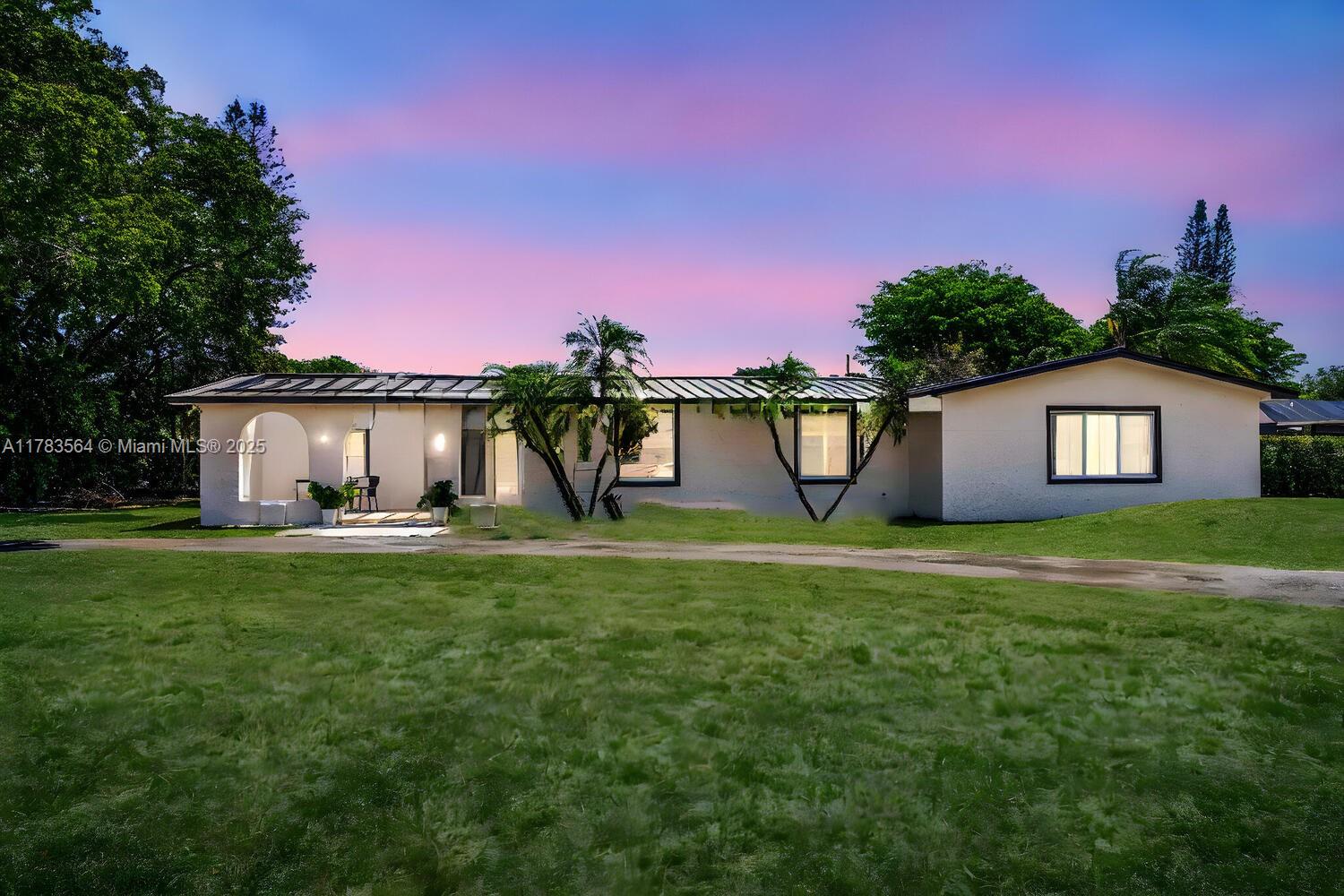 Welcome to this completely remodeled North Palmetto Bay Jennings pool home, situated on a ½-acre fenced corner lot. This spacious 5 bed, 3 bath residence offers porcelain tile throughout, an updated kitchen with white cabinetry, marble countertops, and stainless steel appliances. Renovated bathrooms, recessed lighting, and natural light add to the home's appeal. Exterior upgrades include a new metal roof, impact windows/doors, and a beautifully tiled pool with two covered patio areas—ideal for relaxing or entertaining. Other features include indoor laundry, ample storage, a garage converted with A/C (easily reversible), PVC plumbing, underground electric, and a new septic drain field. Just minutes from top-rated schools, shops, and dining. Move-in ready!