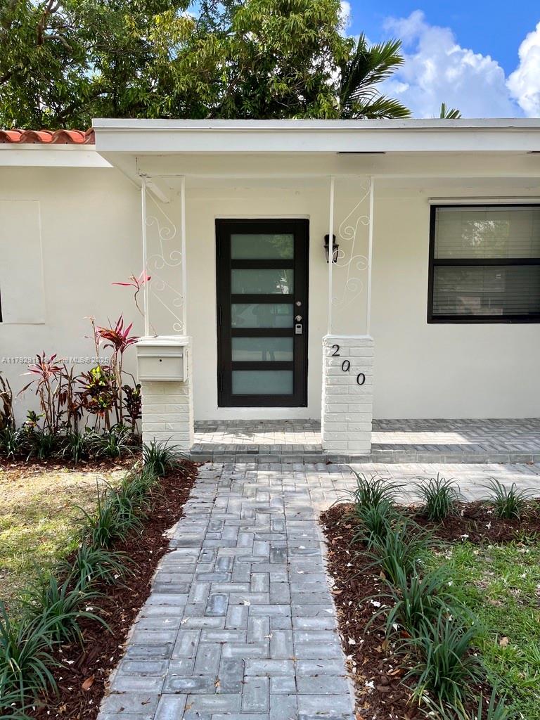 Beautifully updated single-family home in a prime Coral Gables location! Situated on a desirable corner lot, this 3-beds home offers a versatile den, perfect for a home office, media room, or playroom. The 2 new baths are very sleek, and the new kitchen boasts SS appliances and elegant granite countertops. Granite and tile floors flow throughout the living spaces and convenient laundry room. This home is equipped with impact windows and includes a covered garage, additional space and street parking. Step outside to a nice patio, ideal for social gatherings. Enjoy the vibrant urban lifestyle with convenient walkability to Douglas Metro Rail Station, Trader Joe's, Lifetime Gym, and the upscale Merrick Park Shoppes. Just a short drive to the UM and Coconut Grove.  Garden maintenance included!