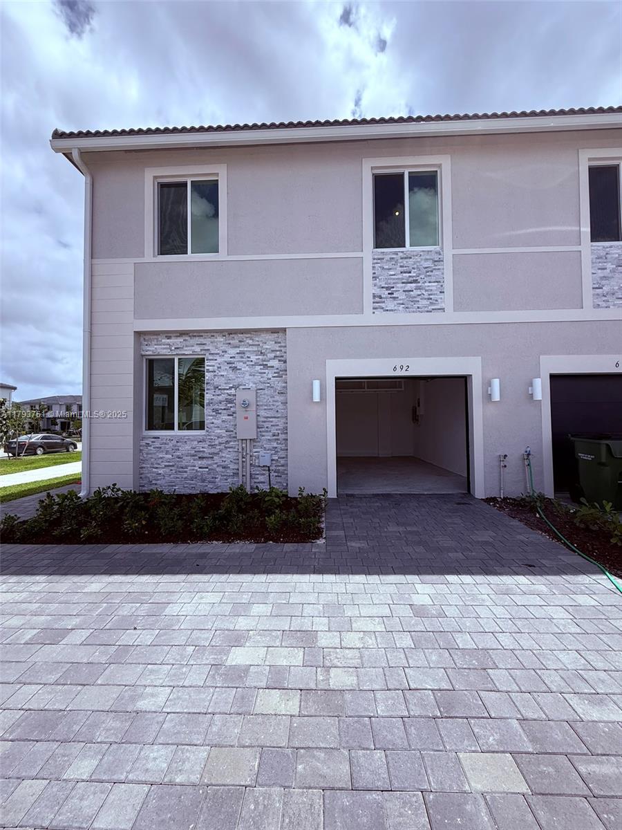 Brand new corner townhouse in Lennar’s Terra Sol community! Be the first to live in this spacious 4-bedroom, 3.5-bath home featuring two master suites with private baths. Enjoy a sleek kitchen with stainless steel appliances, a generous family/dining area, and a separate living room. Includes blinds throughout, washer & dryer, internet, 1-car garage, and driveway parking. Large fenced patio ideal for entertaining. Located near Florida Keys Outlet Mall, dining, and shopping. Bright, modern, and move-in ready in a peaceful, newly built community.
