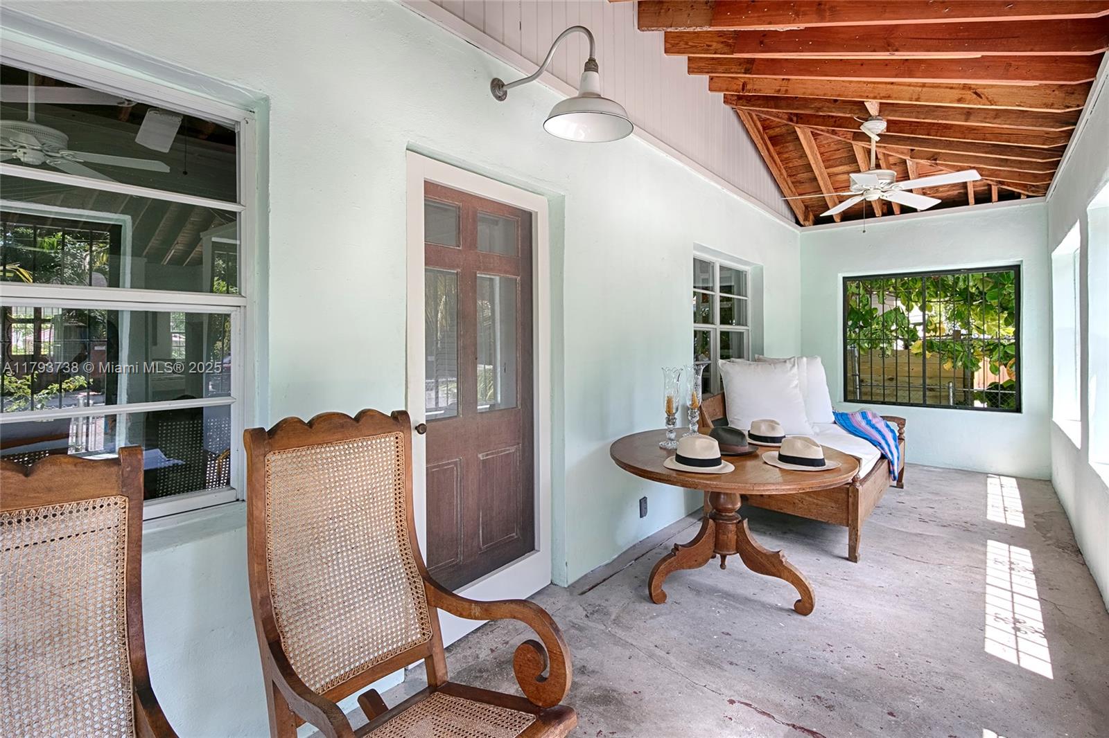 It is Coconut Grove Living! It is a one-of-a-kind Rustic-Chic Cottage with a lot of character... high cathedral ceilings with exposed wood trusses, wood floors and an open floor plan and don't forget to Enjoy the simplicity of a front porch!