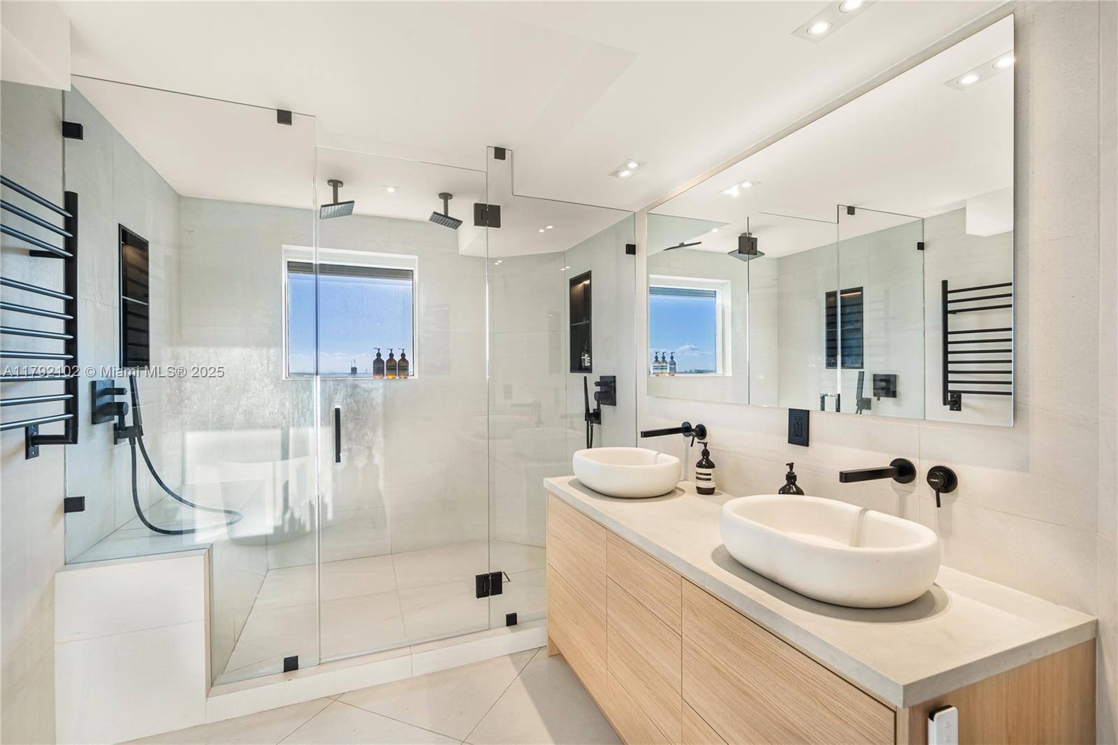 No assessments - Healthy reserves. Discover unparalleled luxury in this designer-renovated corner unit, crafted with no expense spared. Ocean Front with Boat Slips Available. Featuring impact sliding doors and abundant natural light. All new bathrooms offering dual shower systems, heated toilets w/ bidet, a heated towel rack, and a hot/cold plunge. Enjoy ocean sunrises and city skyline sunsets from two balconies. The open layout with split bedrooms provides privacy and spaciousness, including automatic blinds, built in speaker systems, and all new specious closets. The boutique-style building offers quick elevator access, above ground valet + premium SELF parking, beach club, tennis courts, a private marina, and exclusive dining. Showings are easy. Assigned Premium Parking & Storage