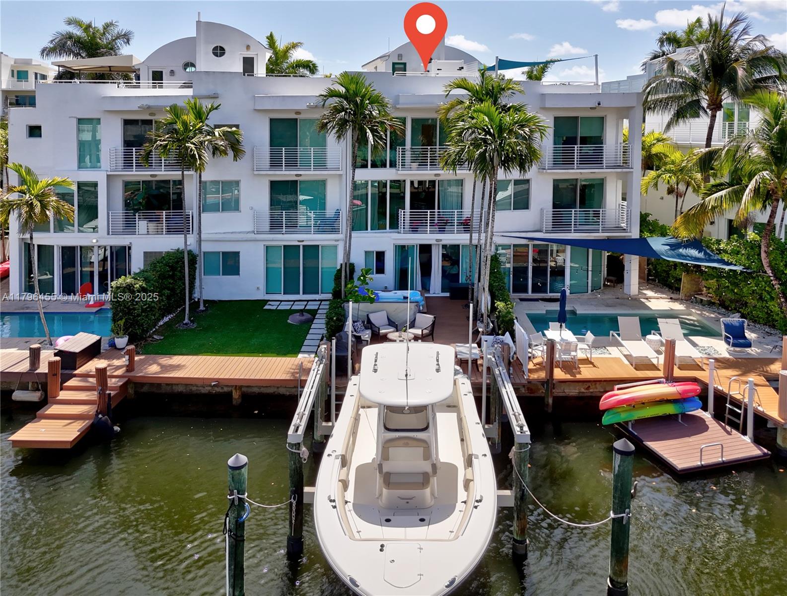 Welcome to 429 Hendricks Isle! This 3 bed 3.5 bath, 2,457 square foot townhome was constructed in 2004 and is full of South Florida charm. Featuring 3 stories, with elevator, boat lift (up to 15,000lbs) and rooftop putting green with outdoor kitchen- experience all the best amenities that Fort Lauderdale has to offer. Featuring newly installed floor to ceiling impact windows in the living area. One bedroom and  full bath on ground floor. Primary bedroom, that overlooks waterway,  and additional bedroom (both en suite bath) on third level. Located towards the end of Hendricks Isle, a dead end street, yet a quick walk to Las Olas and Fort Lauderdale Beach. Schedule a showing today to see what life on the water is all about! HD video available upon request.